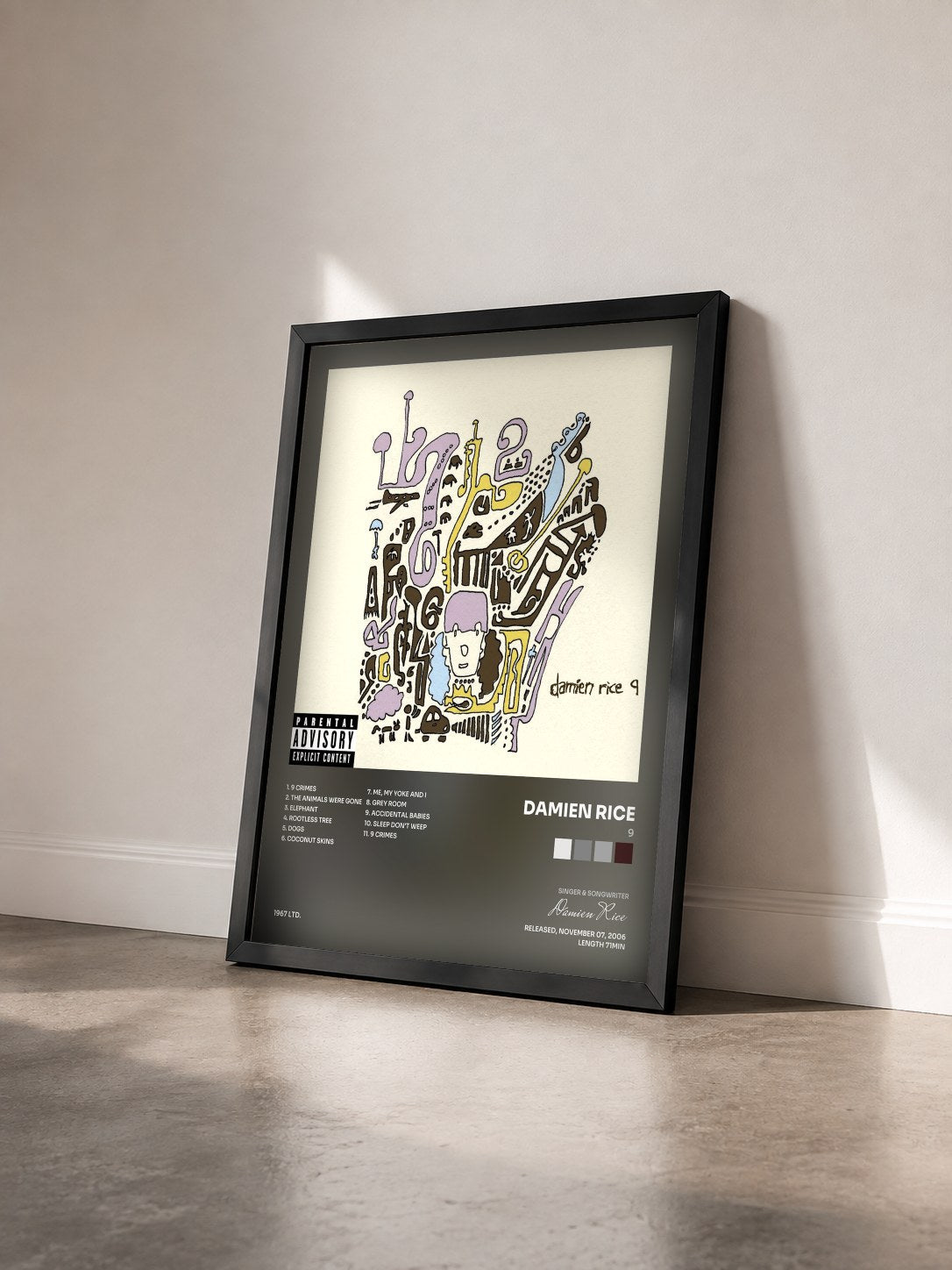 #noir Tableau de l'album 9 de Damien Rice vu de trois quarts, cadre noir