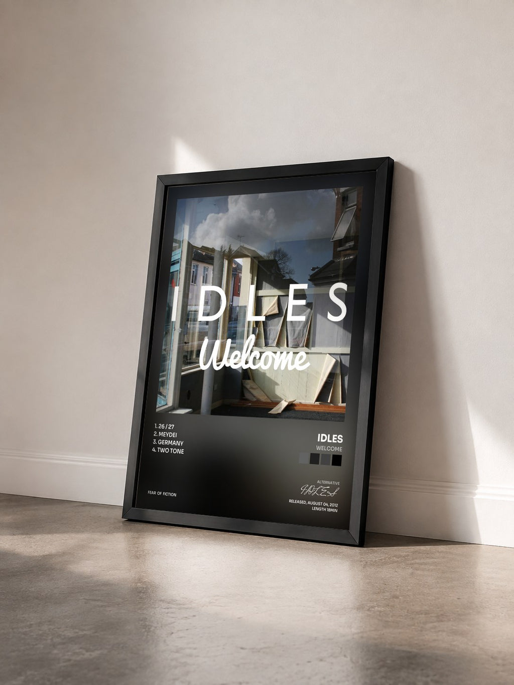 #noir Tableau de l'album Welcome de IDLES vu de trois quarts, cadre noir