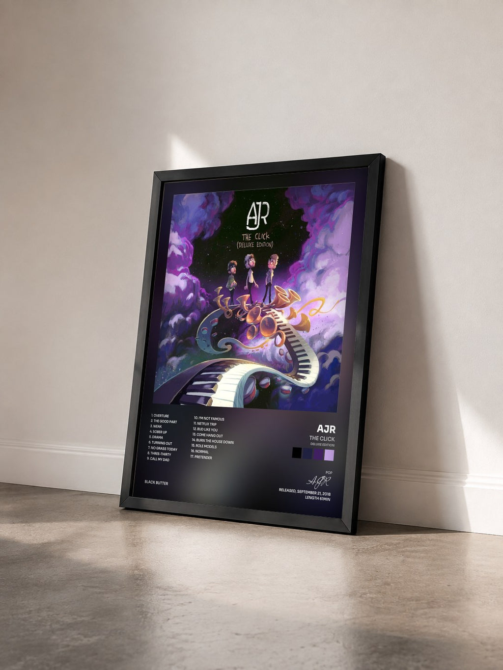 #noir Tableau de l'album The Click (Deluxe Edition) de AJR vu de trois quarts, cadre noir
