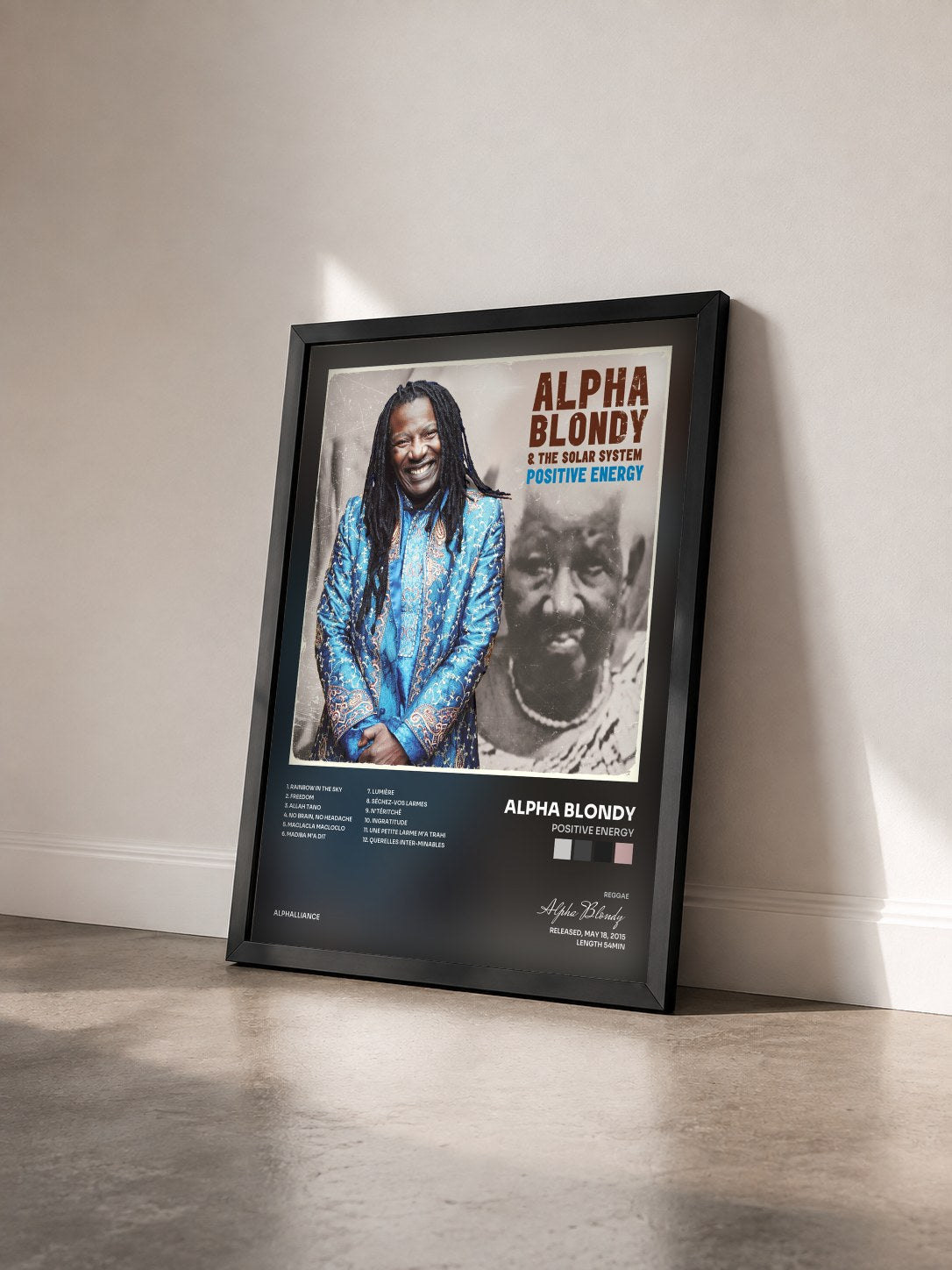 #noir Tableau de l'album Positive Energy de Alpha Blondy vu de trois quarts, cadre noir