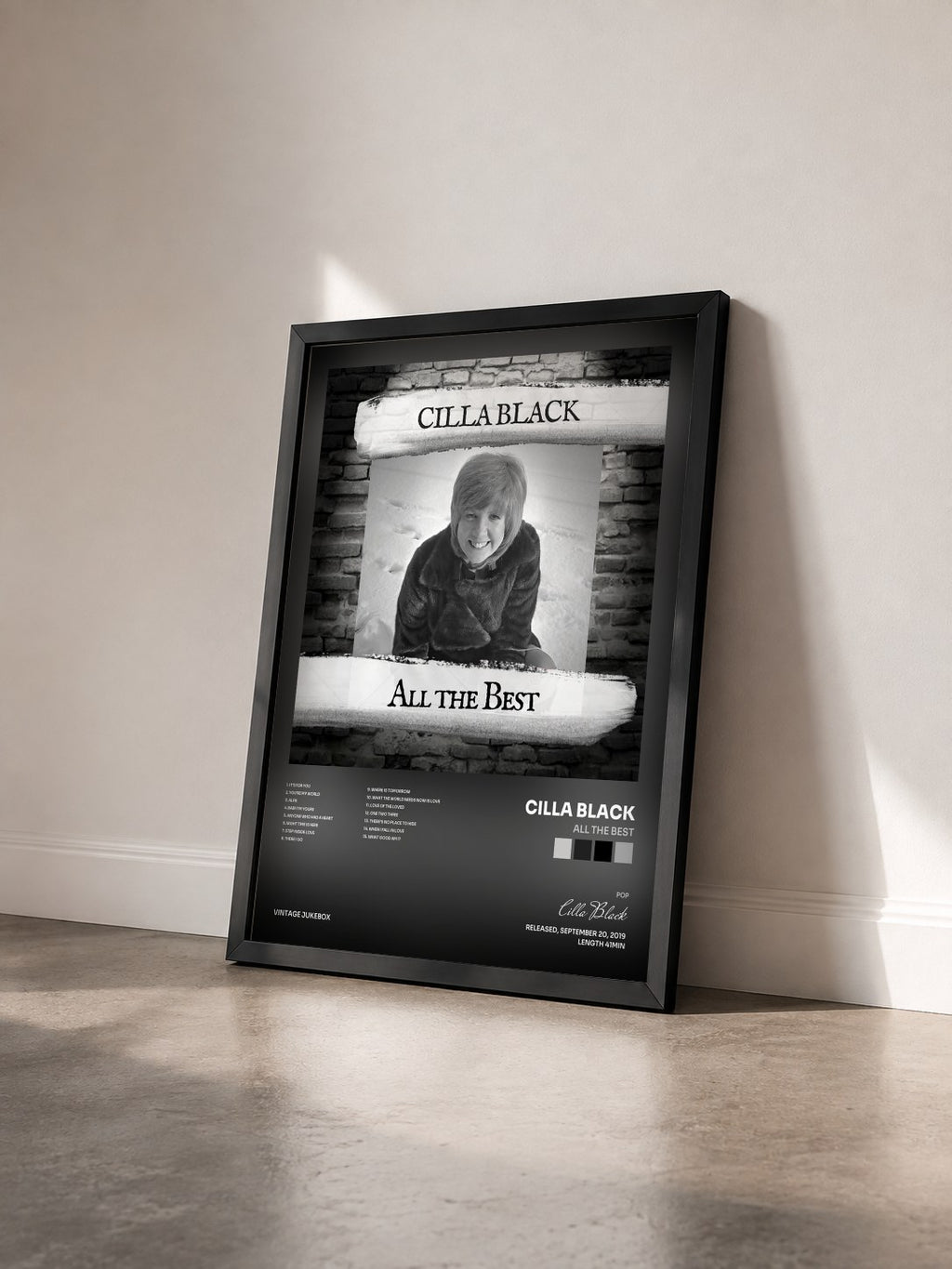 #noir Tableau de l'album All The Best de Cilla Black vu de trois quarts, cadre noir