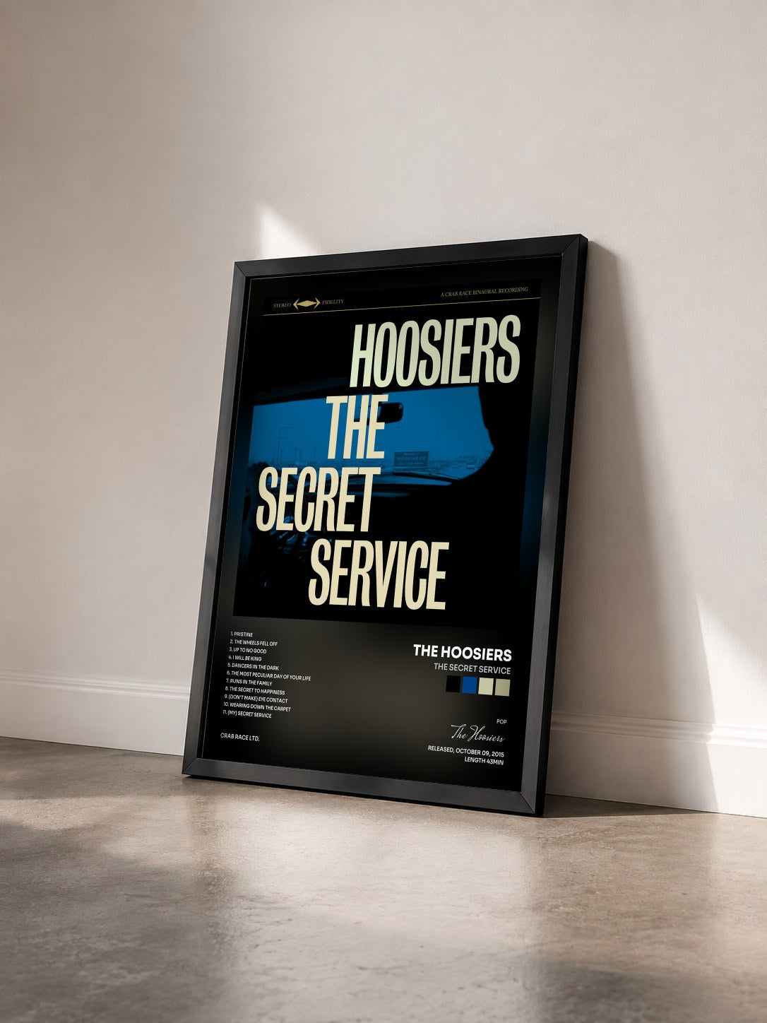 #noir Tableau de l'album The Secret Service de The Hoosiers vu de trois quarts, cadre noir