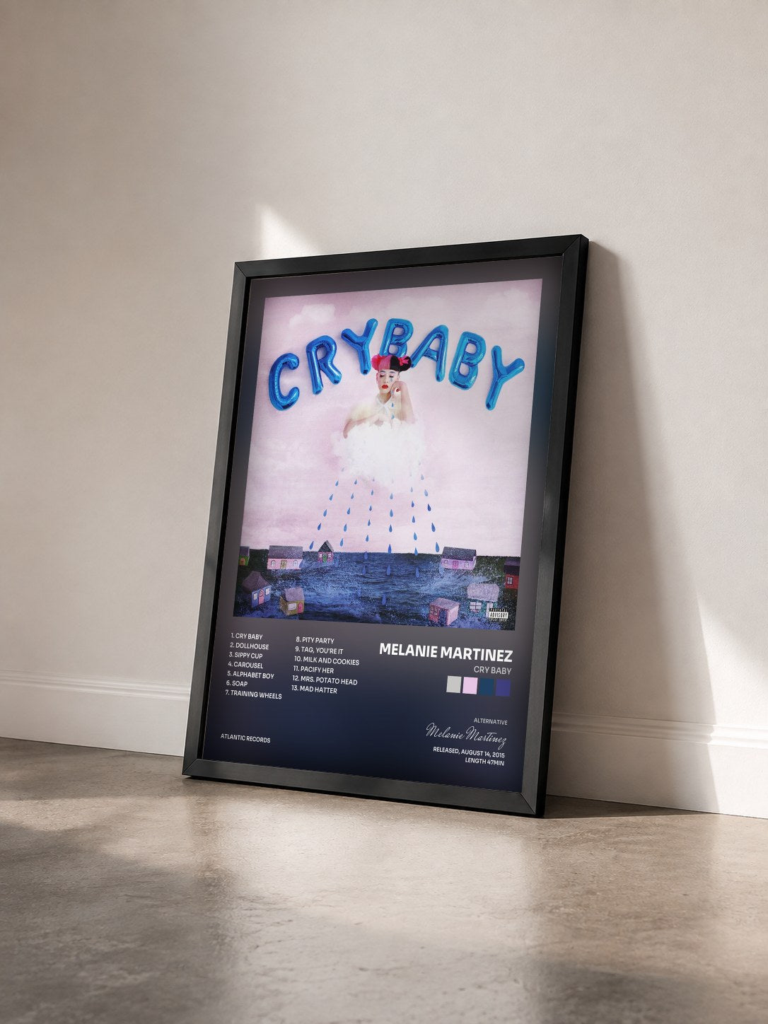 #noir Tableau de l'album Cry Baby de Melanie Martinez vu de trois quarts, cadre noir