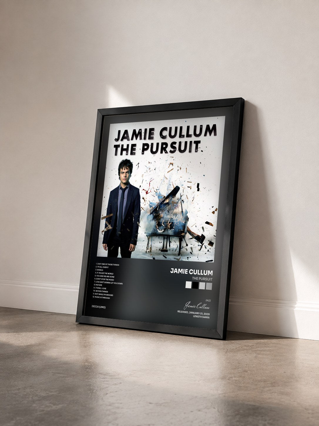 #noir Tableau de l'album The Pursuit de Jamie Cullum vu de trois quarts, cadre noir