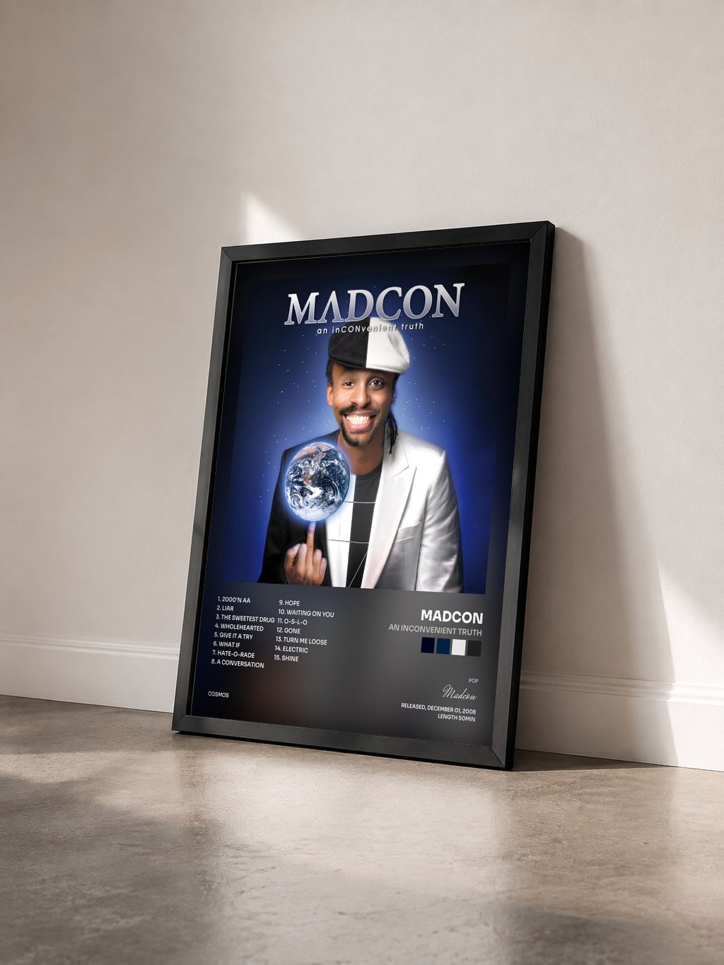 #noir Tableau de l'album An Inconvenient Truth de Madcon vu de trois quarts, cadre noir