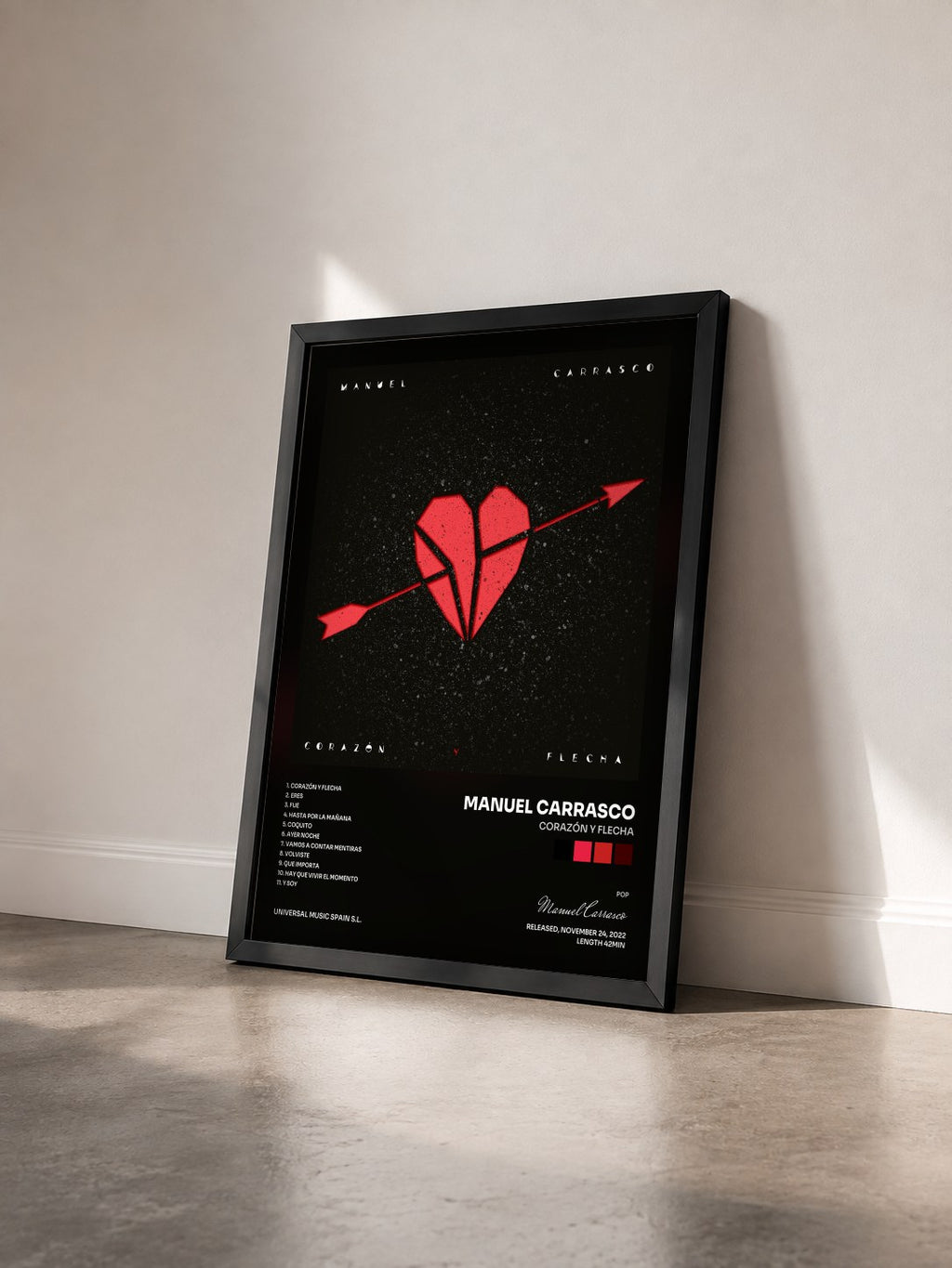 #noir Tableau de l'album Corazón Y Flecha de Manuel Carrasco vu de trois quarts, cadre noir