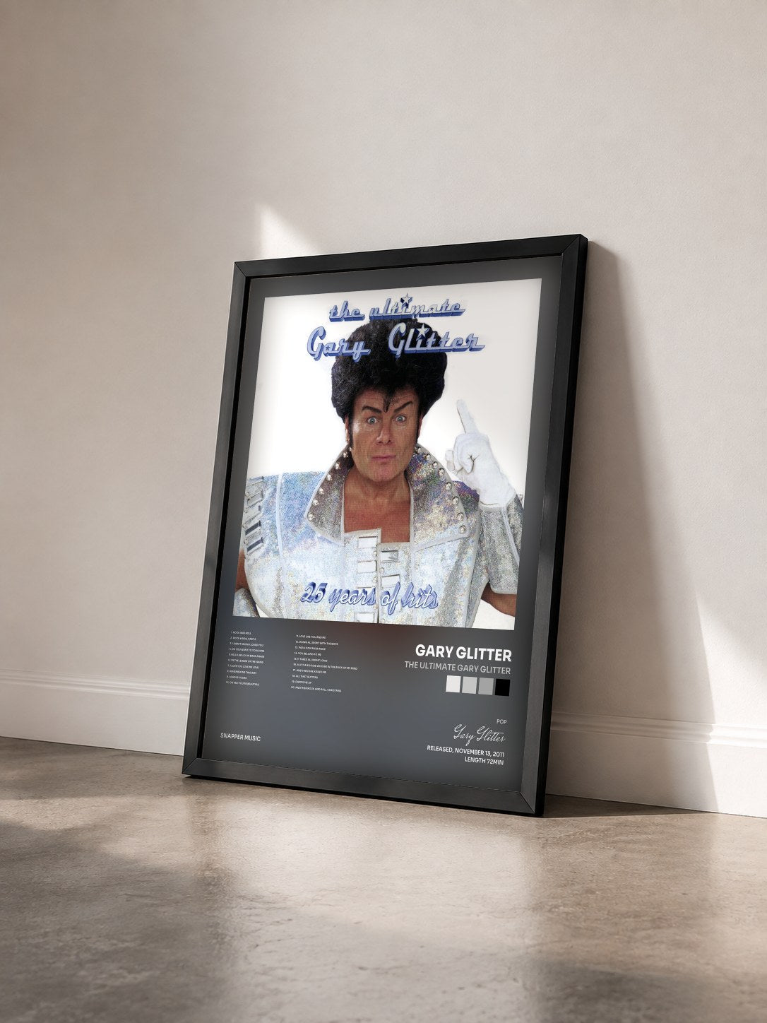 #noir Tableau de l'album The Ultimate Gary Glitter de Gary Glitter vu de trois quarts, cadre noir