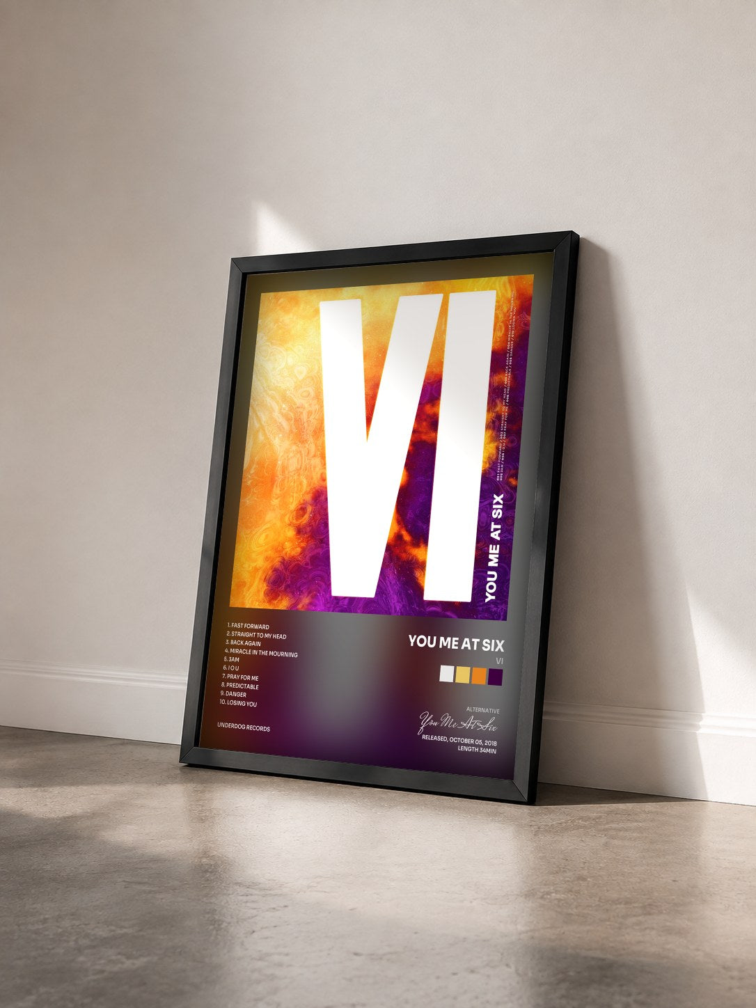 #noir Tableau de l'album VI de You Me At Six vu de trois quarts, cadre noir