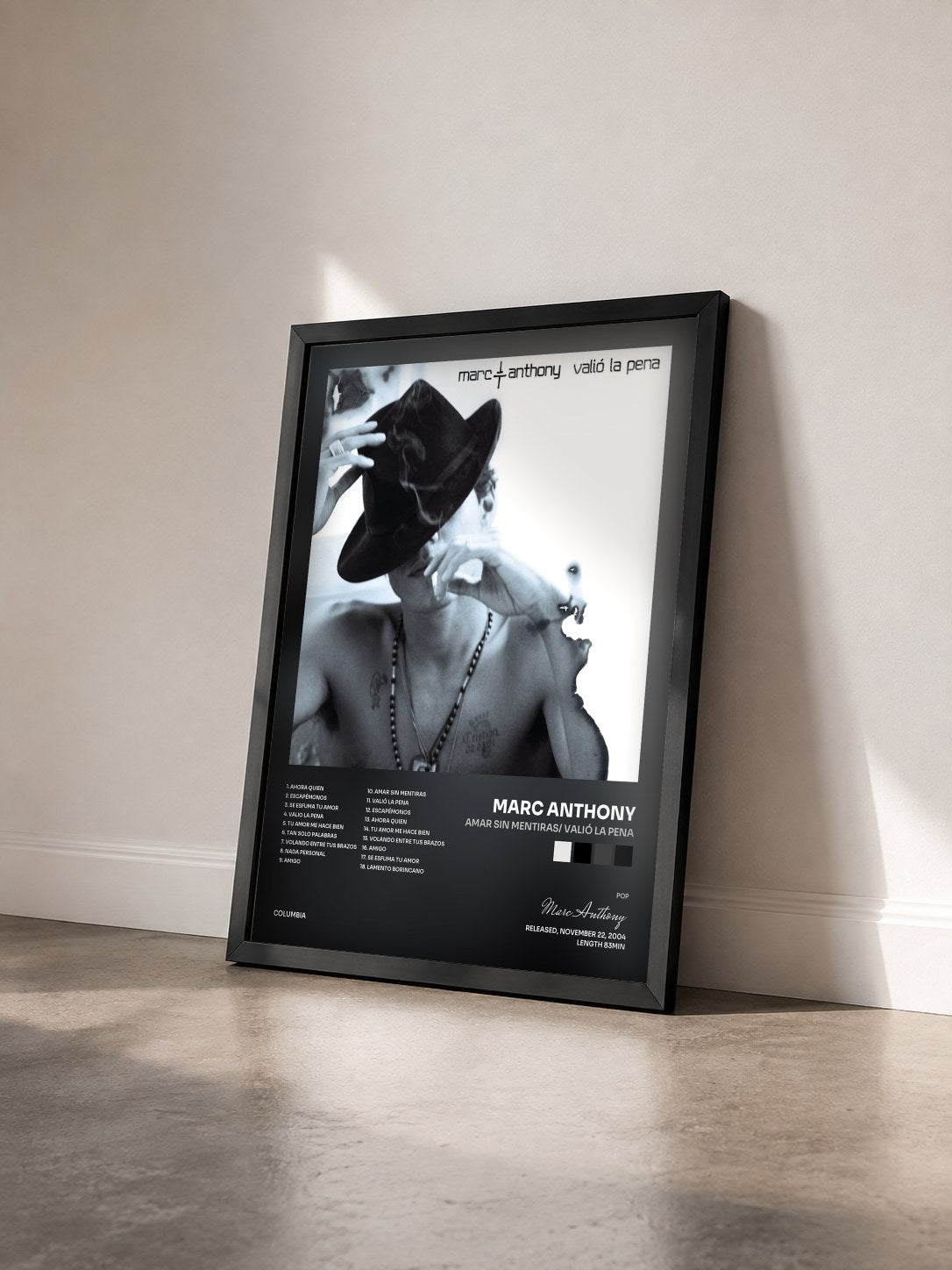 #noir Tableau de l'album Amar Sin Mentiras/ Valió La Pena de Marc Anthony vu de trois quarts, cadre noir