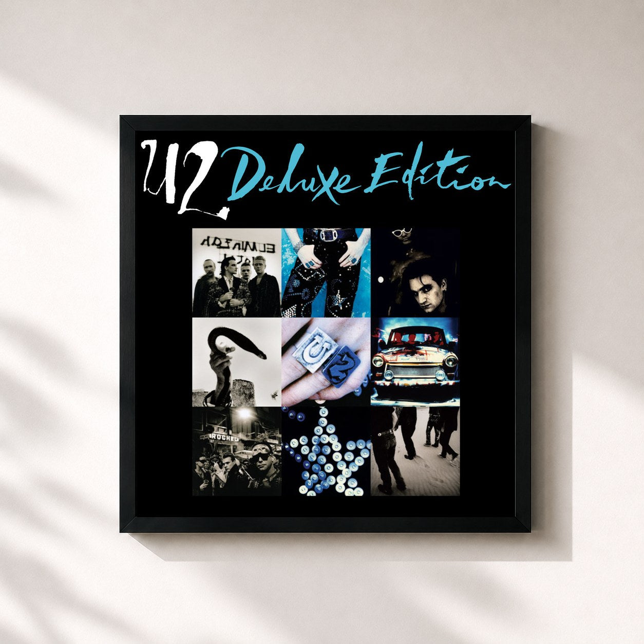 #noir Achtung Baby (Deluxe Edition) by U2 as a square framed art print, black 32x32 cm frame