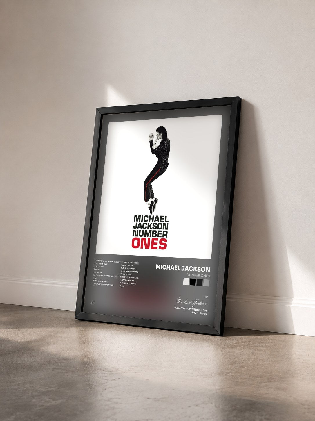 #noir Tableau de l'album Number Ones de Michael Jackson vu de trois quarts, cadre noir