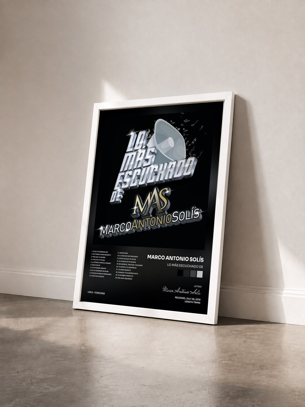#blanc Lo Más Escuchado De by Marco Antonio Solís as a framed art print seen at an angle, white frame