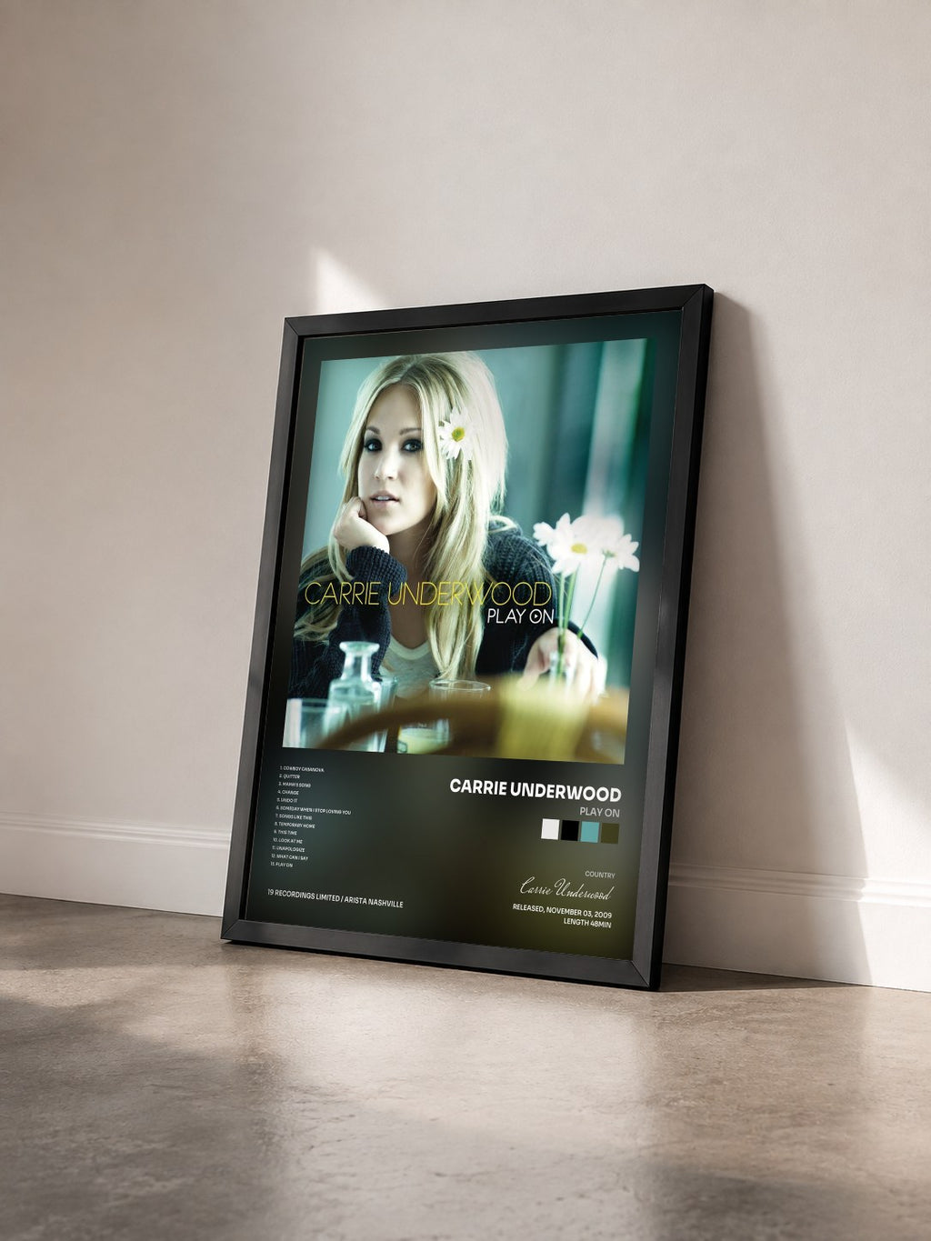 #noir Tableau de l'album Play On de Carrie Underwood vu de trois quarts, cadre noir