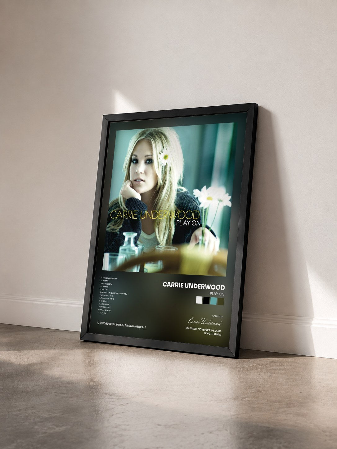 #noir Tableau de l'album Play On de Carrie Underwood vu de trois quarts, cadre noir