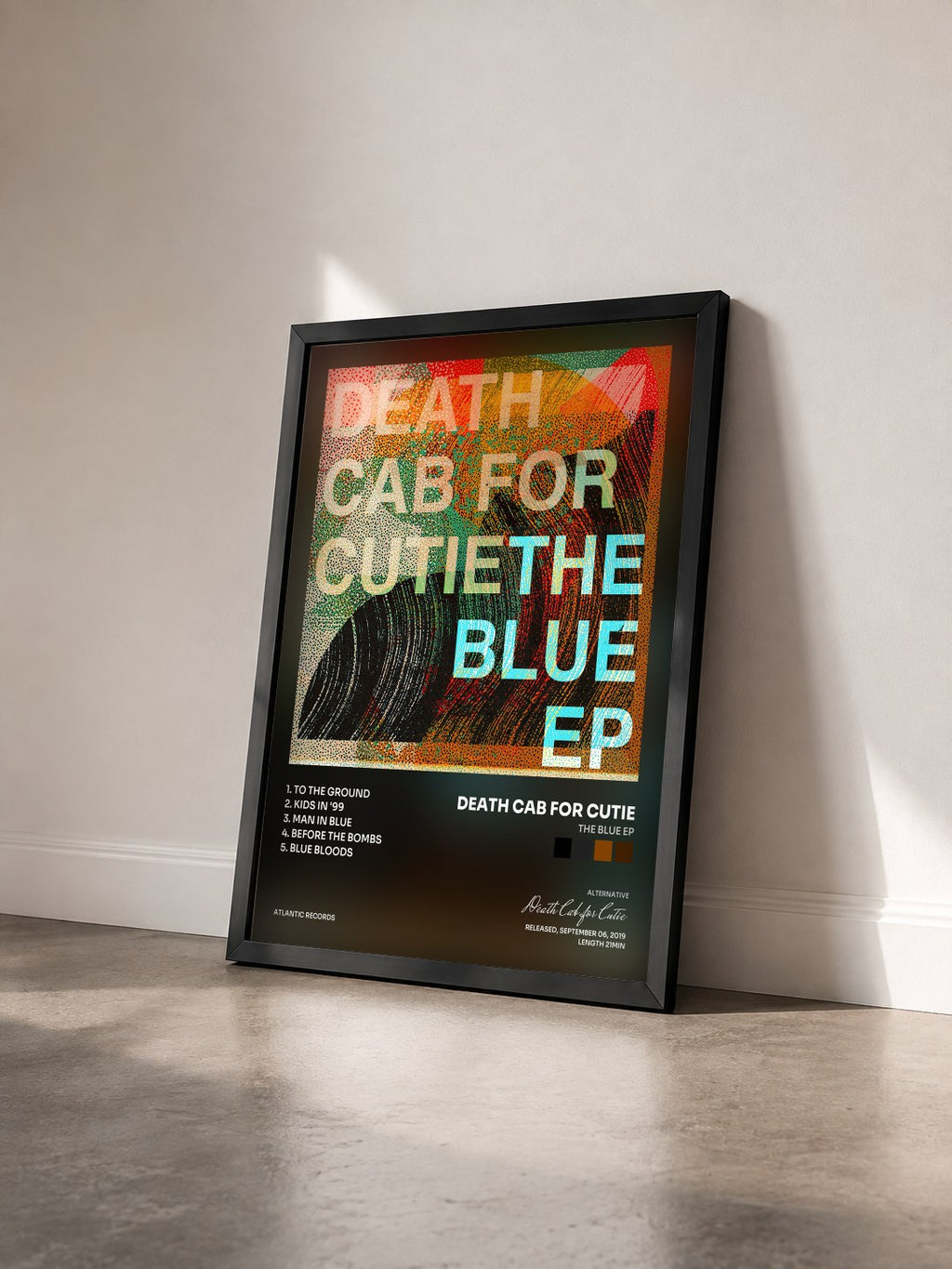 #noir Tableau de l'album The Blue EP de Death Cab for Cutie vu de trois quarts, cadre noir