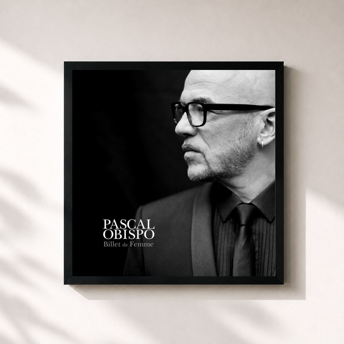 #noir Billet by femme de Pascal Obispo as a square framed art print, black 32x32 cm frame