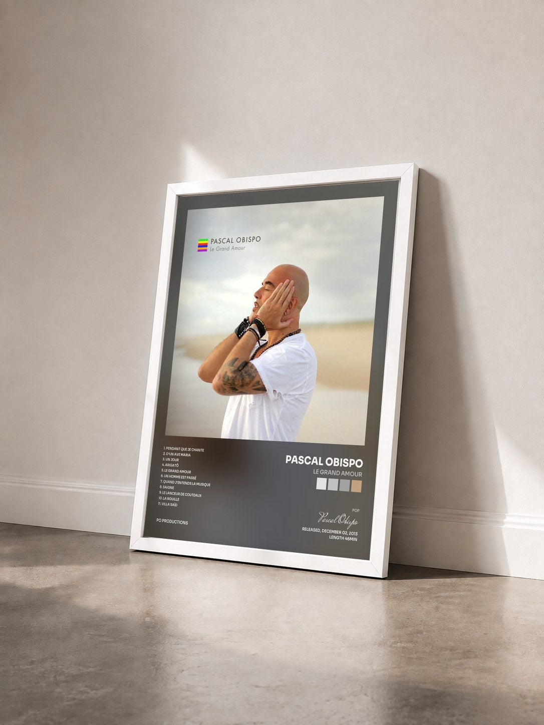#blanc Le Grand Amour by Pascal Obispo as a framed art print seen at an angle, white frame