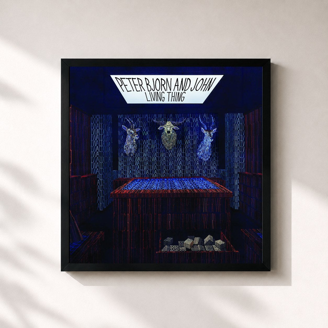 #noir Tableau carré de l'album Living Thing de Peter Bjorn and John, cadre noir 32x32 cm