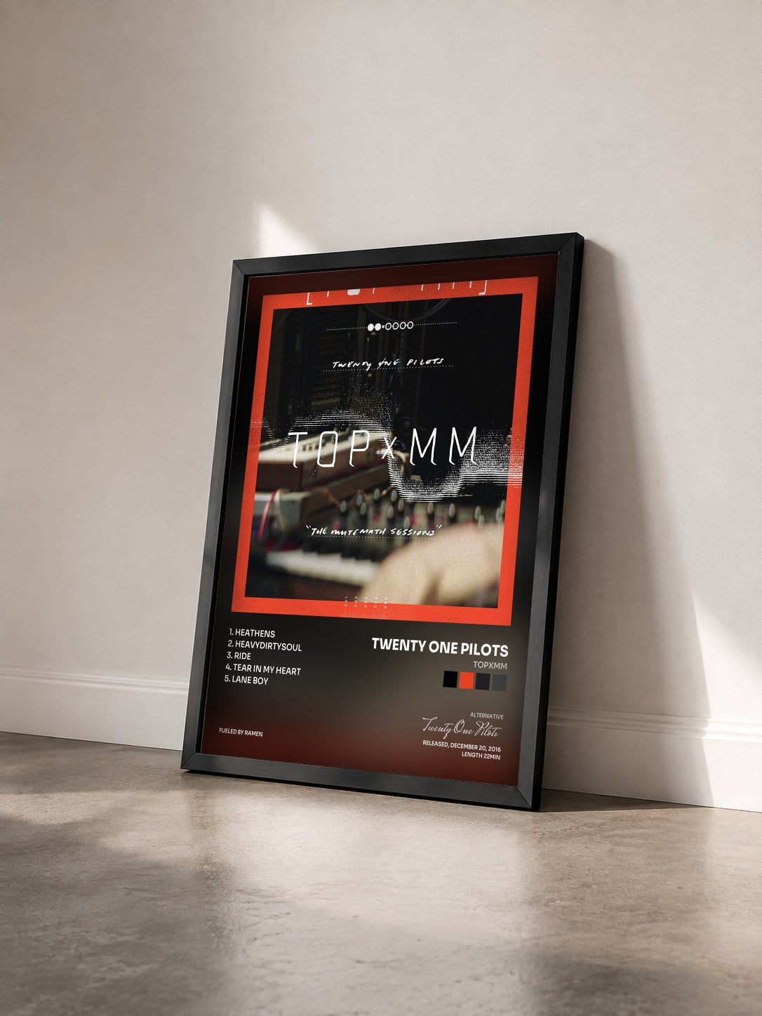 #noir TOPxMM by Twenty One Pilots as a framed art print seen at an angle, black frame