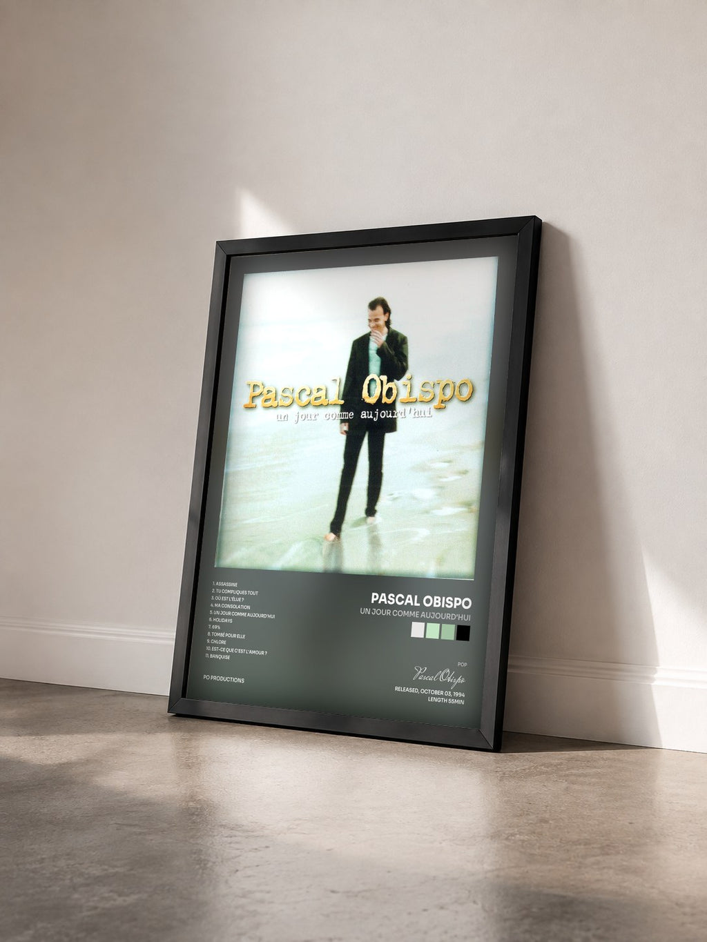 #noir Un jour comme aujourd'hui by Pascal Obispo as a framed art print seen at an angle, black frame