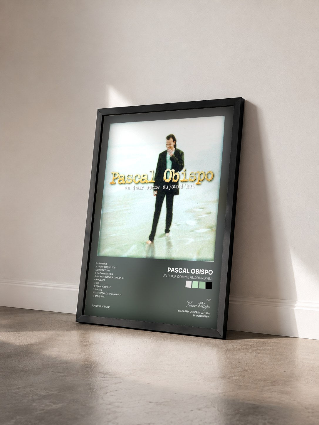 #noir Un jour comme aujourd'hui by Pascal Obispo as a framed art print seen at an angle, black frame