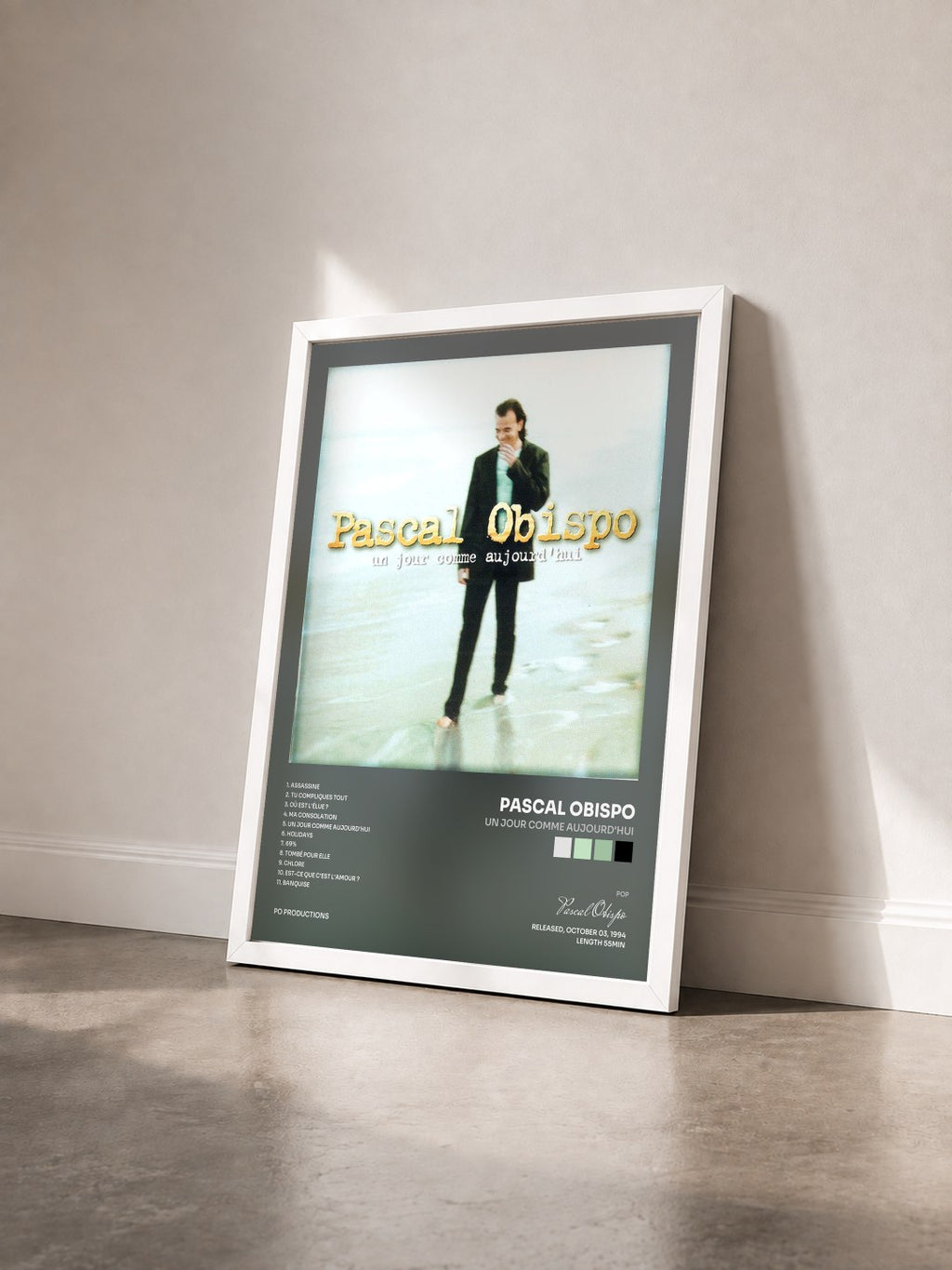 #blanc Un jour comme aujourd'hui by Pascal Obispo as a framed art print seen at an angle, white frame
