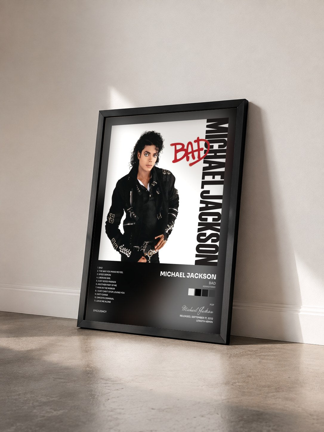 #noir Tableau de l'album Bad (Remastered) de Michael Jackson vu de trois quarts, cadre noir