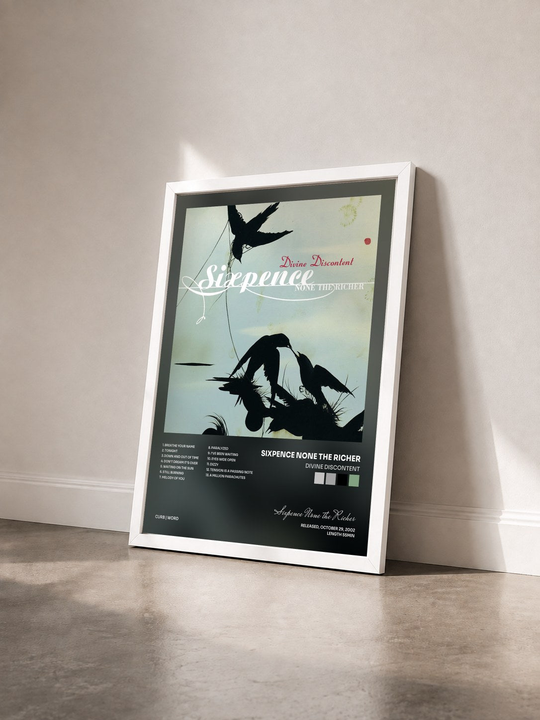 #blanc Tableau de l'album Divine Discontent de Sixpence None the Richer vu de trois quarts, cadre blanc