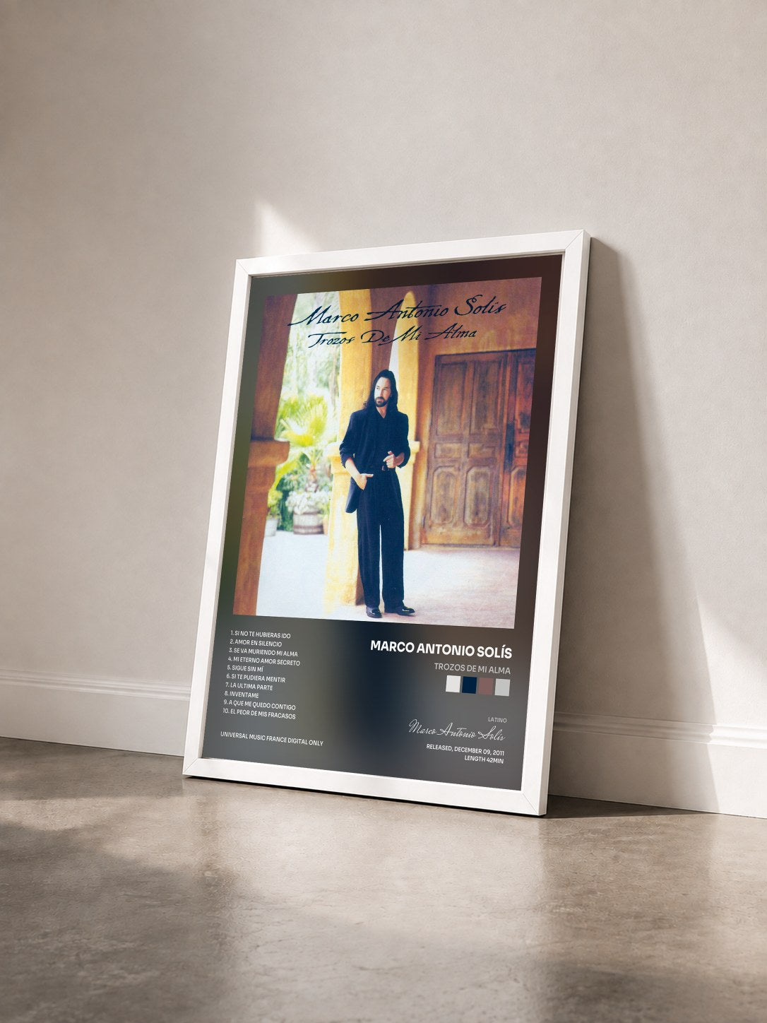 #blanc Tableau de l'album Trozos De Mi Alma de Marco Antonio Solís vu de trois quarts, cadre blanc