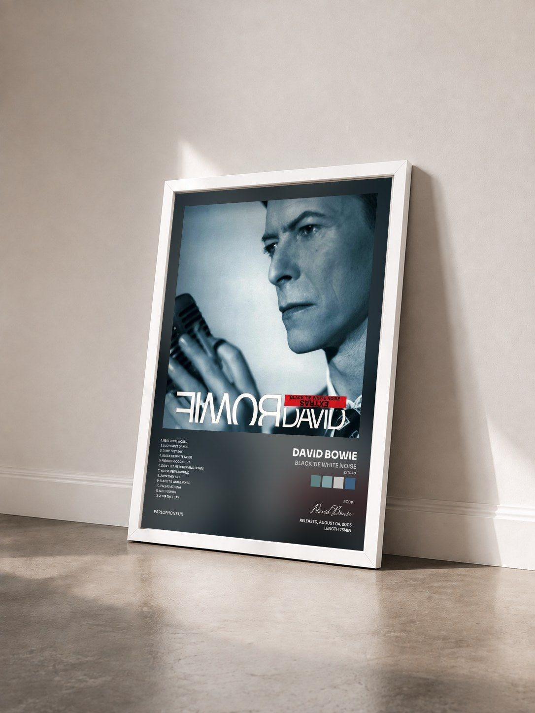 #blanc Tableau de l'album Black Tie White Noise (Extras) de David Bowie vu de trois quarts, cadre blanc