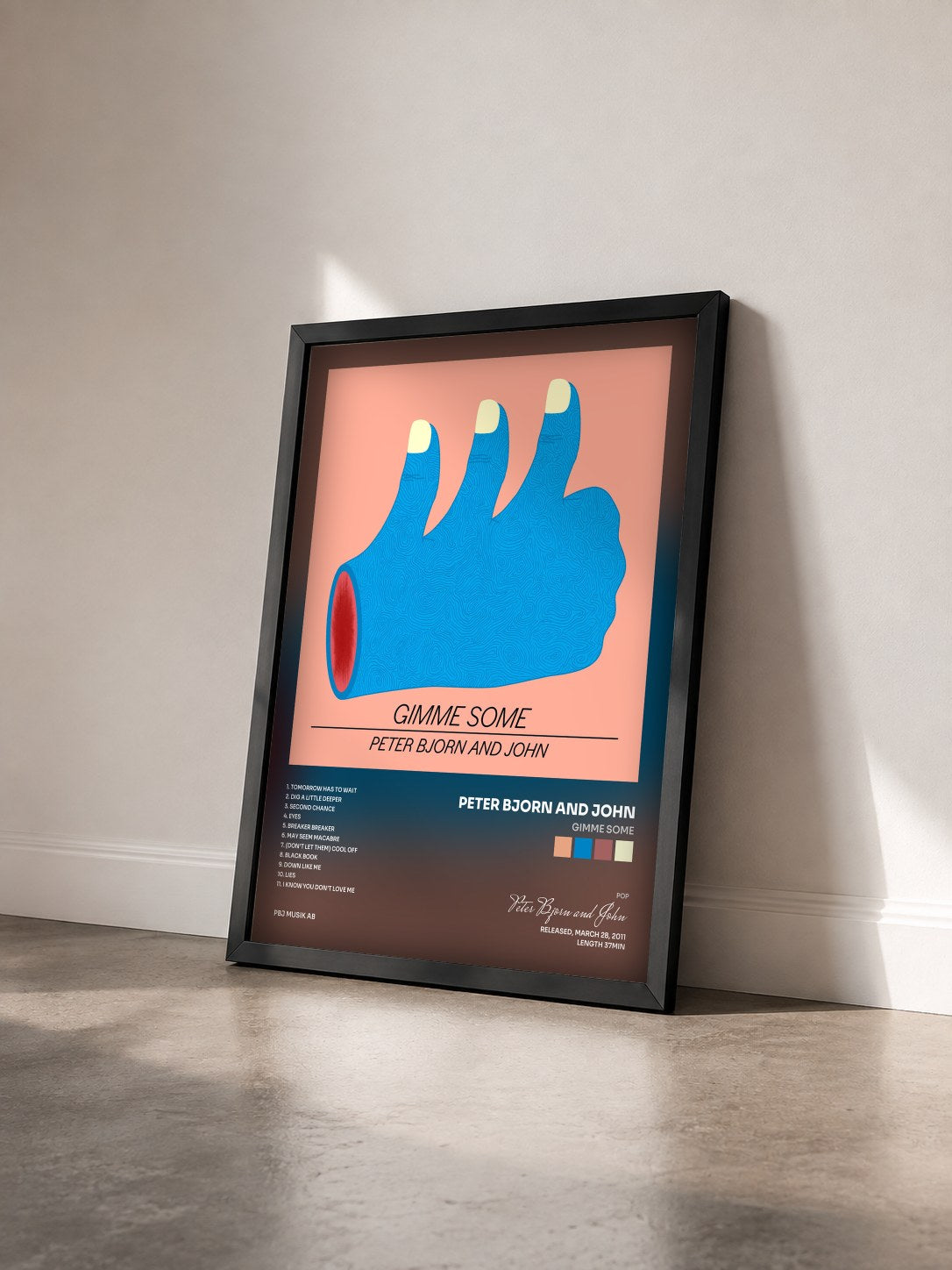 #noir Tableau de l'album Gimme Some de Peter Bjorn and John vu de trois quarts, cadre noir