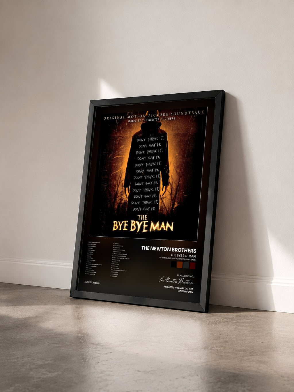 #noir Tableau de l'album The Bye Bye Man (Original Motion Picture Soundtrack) de The Newton Brothers vu de trois quarts, cadre noir