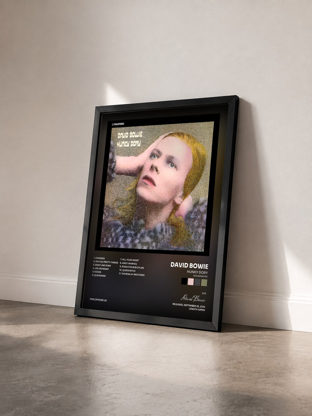 #noir Hunky Dory (2015 Remaster) by David Bowie as a framed art print seen at an angle, black frame