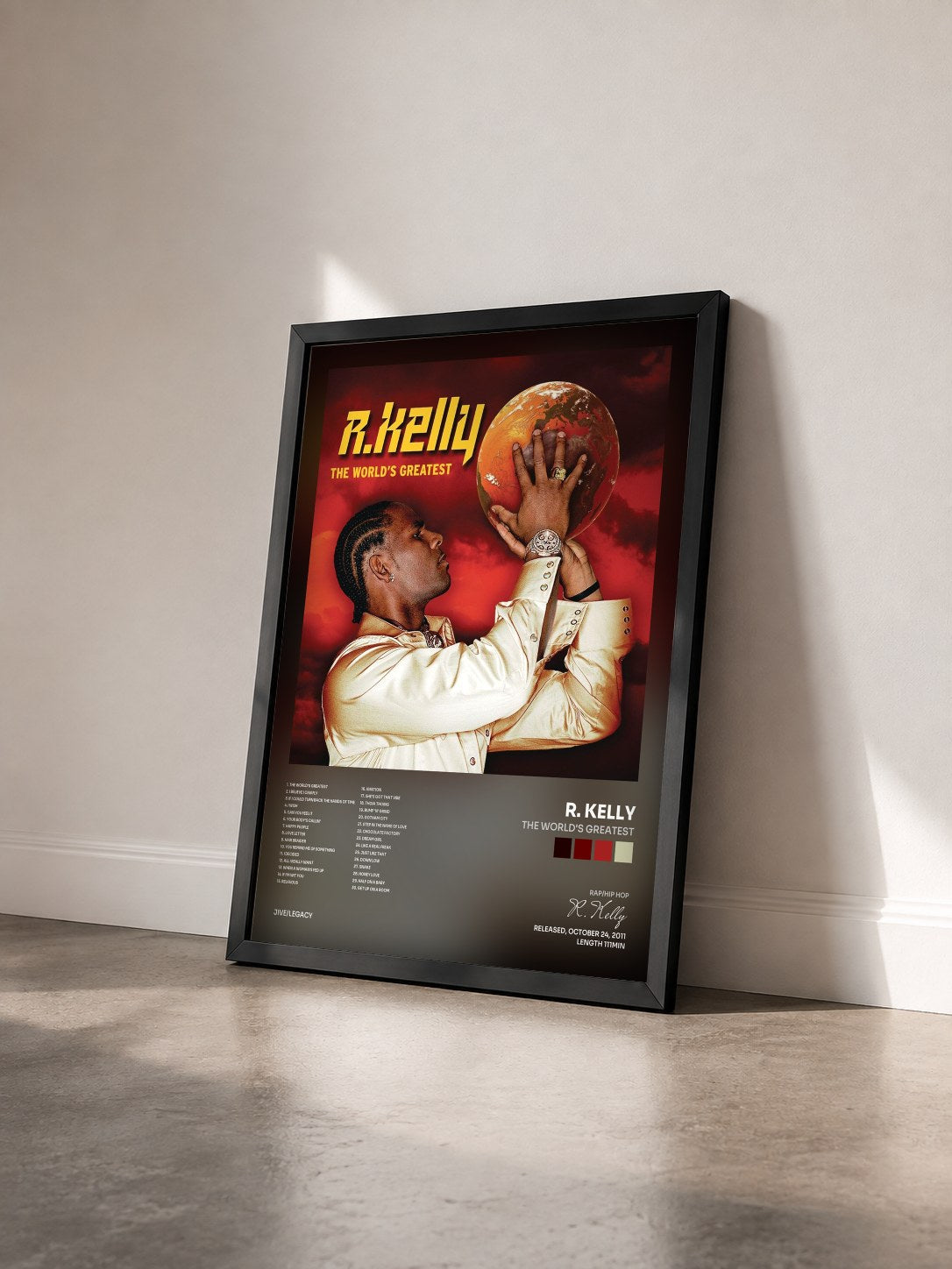 #noir Tableau de l'album The World's Greatest de R. Kelly vu de trois quarts, cadre noir