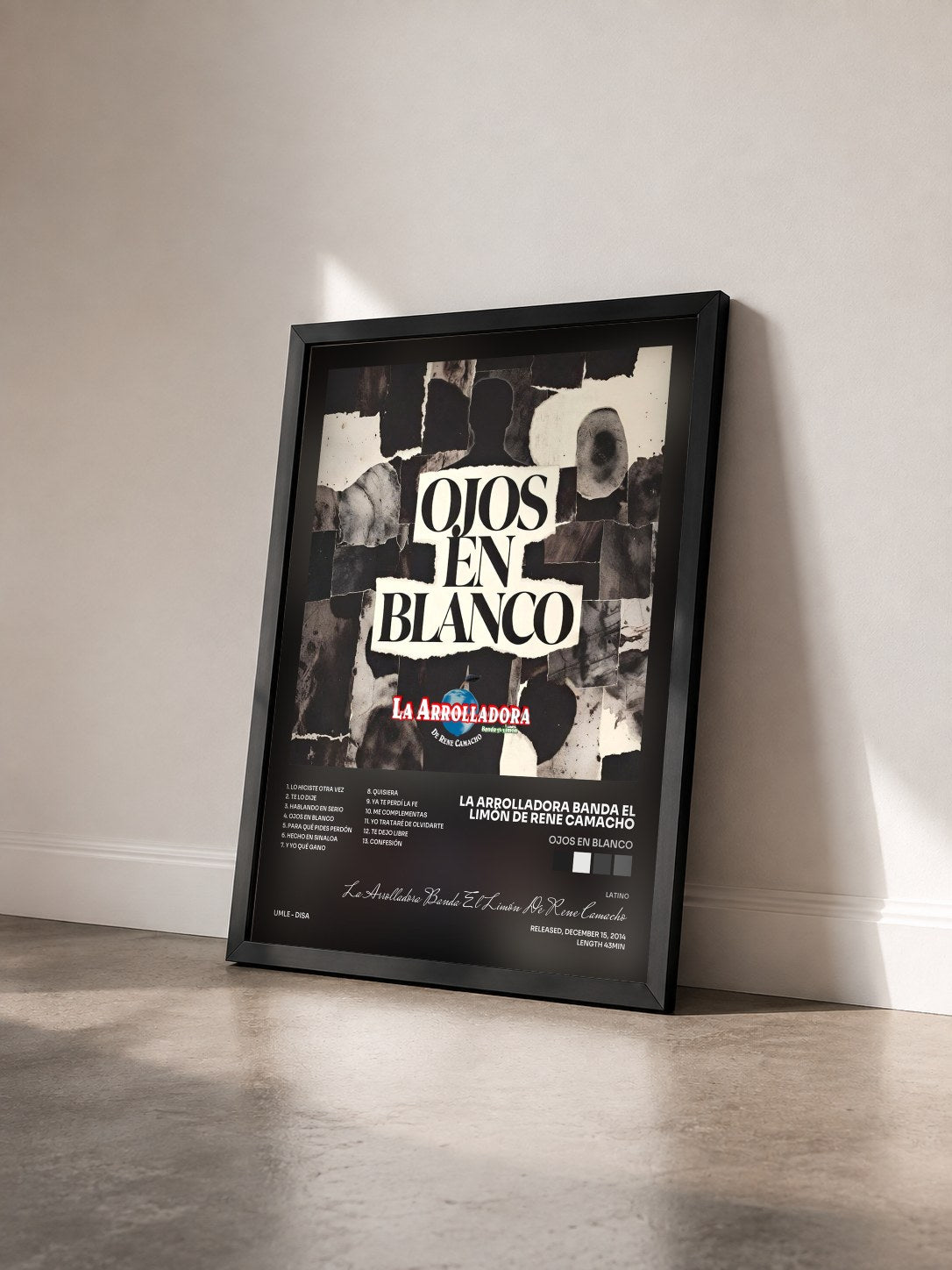 #noir Tableau de l'album Ojos En Blanco de La Arrolladora Banda El Limón De Rene Camacho vu de trois quarts, cadre noir