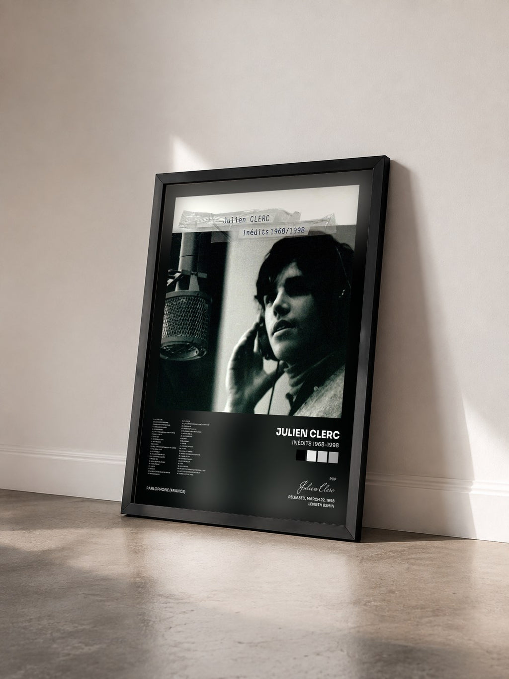 #noir Inédits 1968-1998 by Julien Clerc as a framed art print seen at an angle, black frame