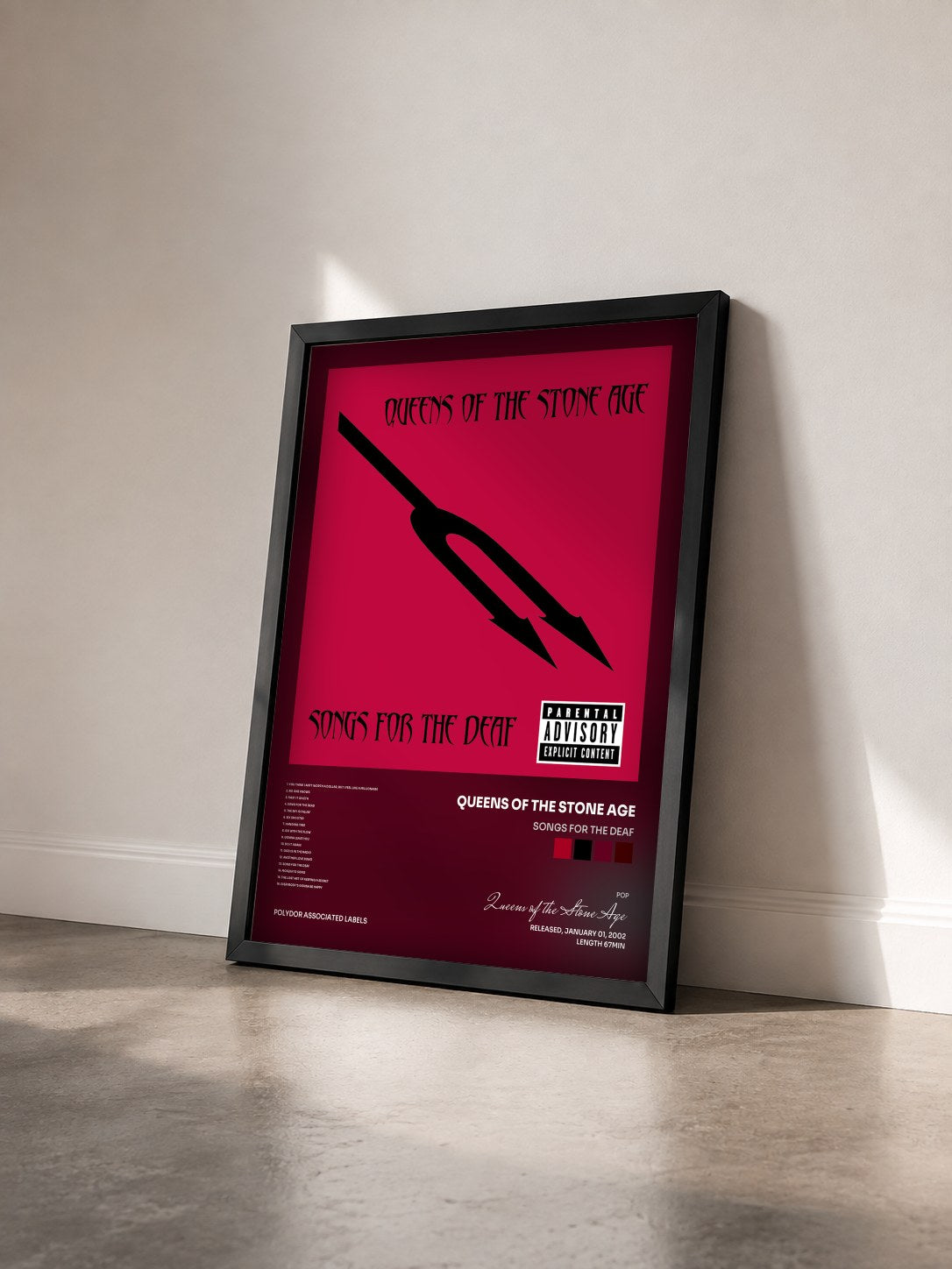 #noir Tableau de l'album Songs For The Deaf de Queens of the Stone Age vu de trois quarts, cadre noir