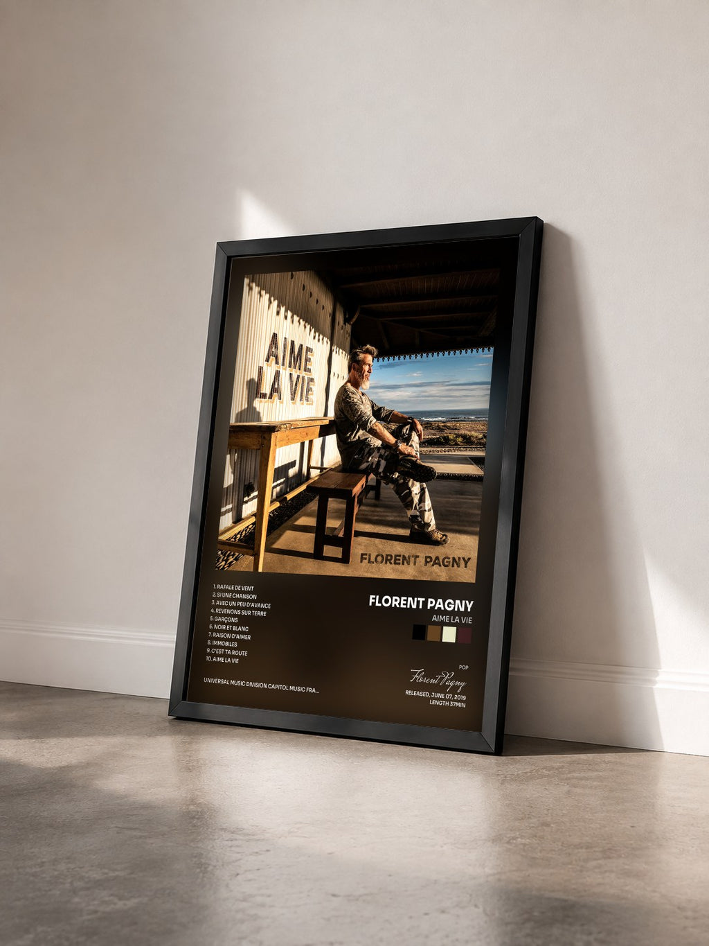 #noir Aime la vie by Florent Pagny as a framed art print seen at an angle, black frame