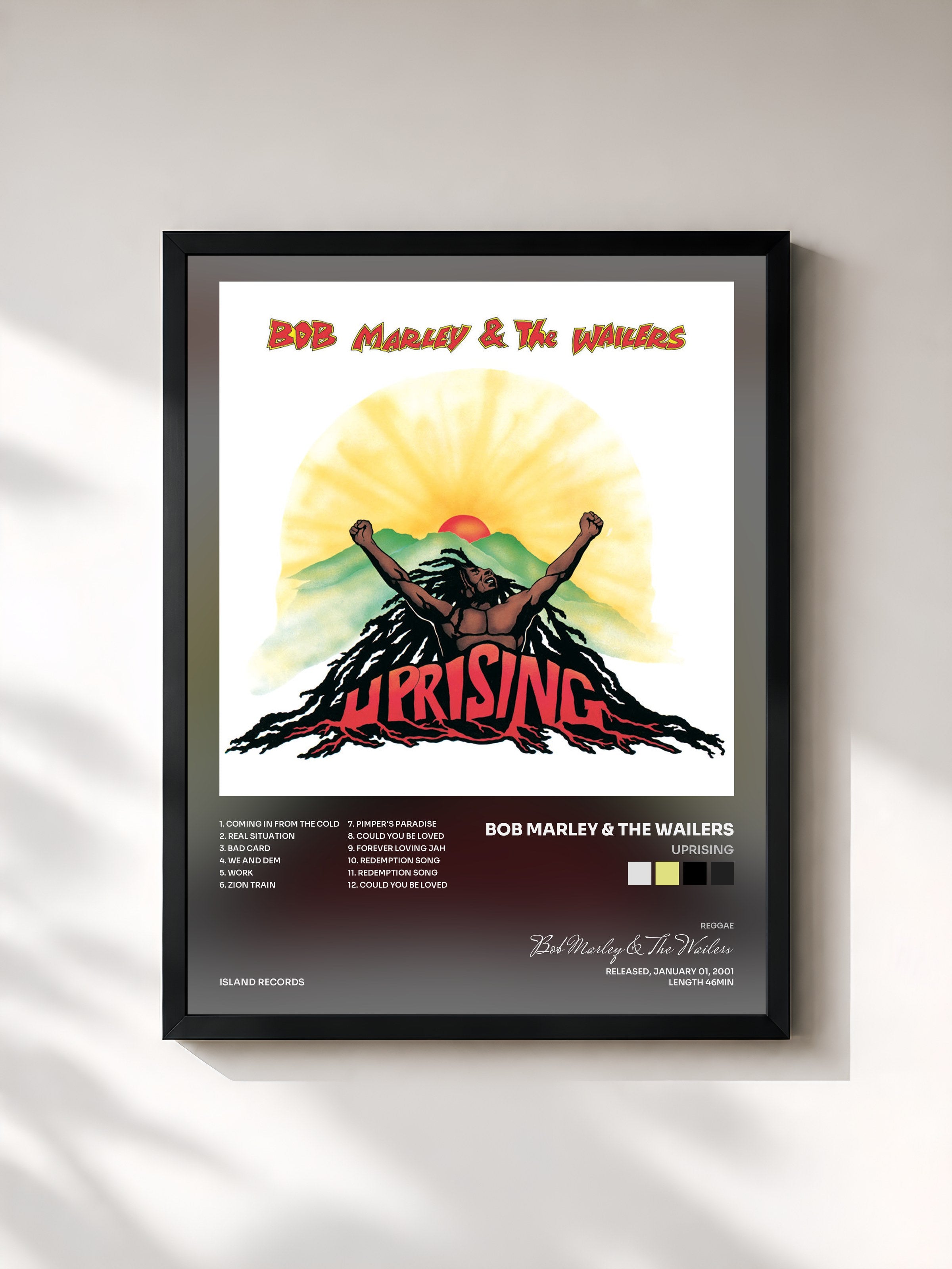 #noir Uprising by Bob Marley & The Wailers as a framed art print, black frame, printed and framed in France