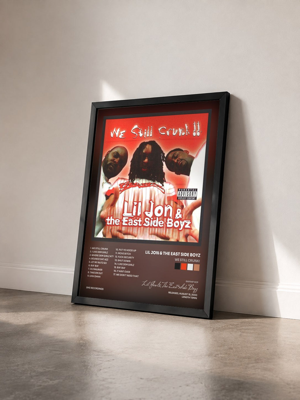 #noir Tableau de l'album We Still Crunk! de Lil Jon & The East Side Boyz vu de trois quarts, cadre noir