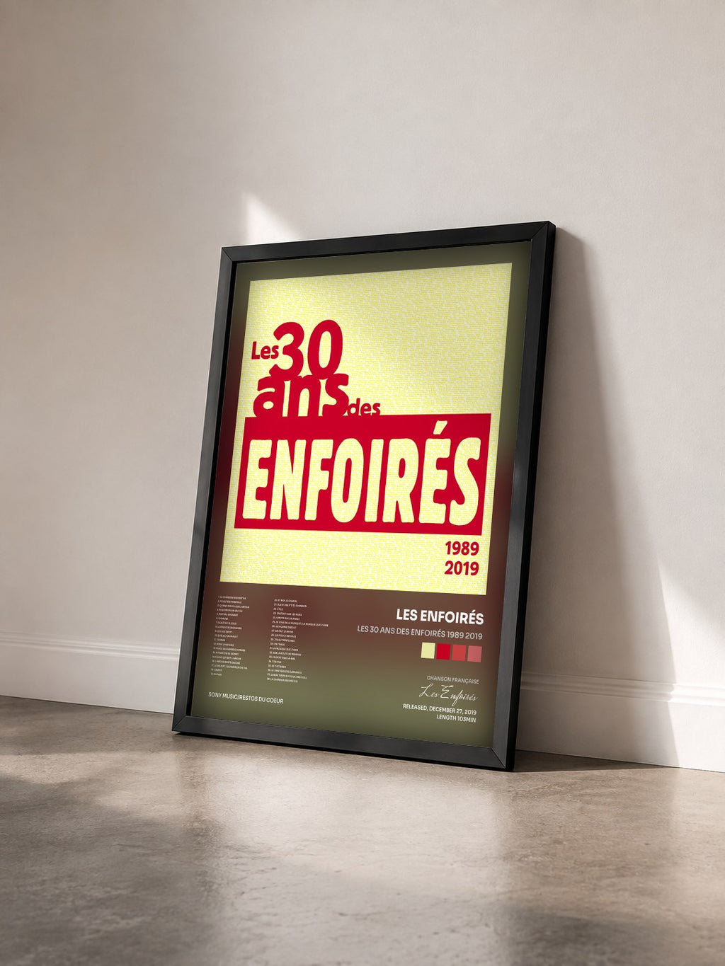 #noir Les 30 ans des Enfoirés 1989 2019 di Les Enfoirés in stampa incorniciata vista di tre quarti, cornice nera