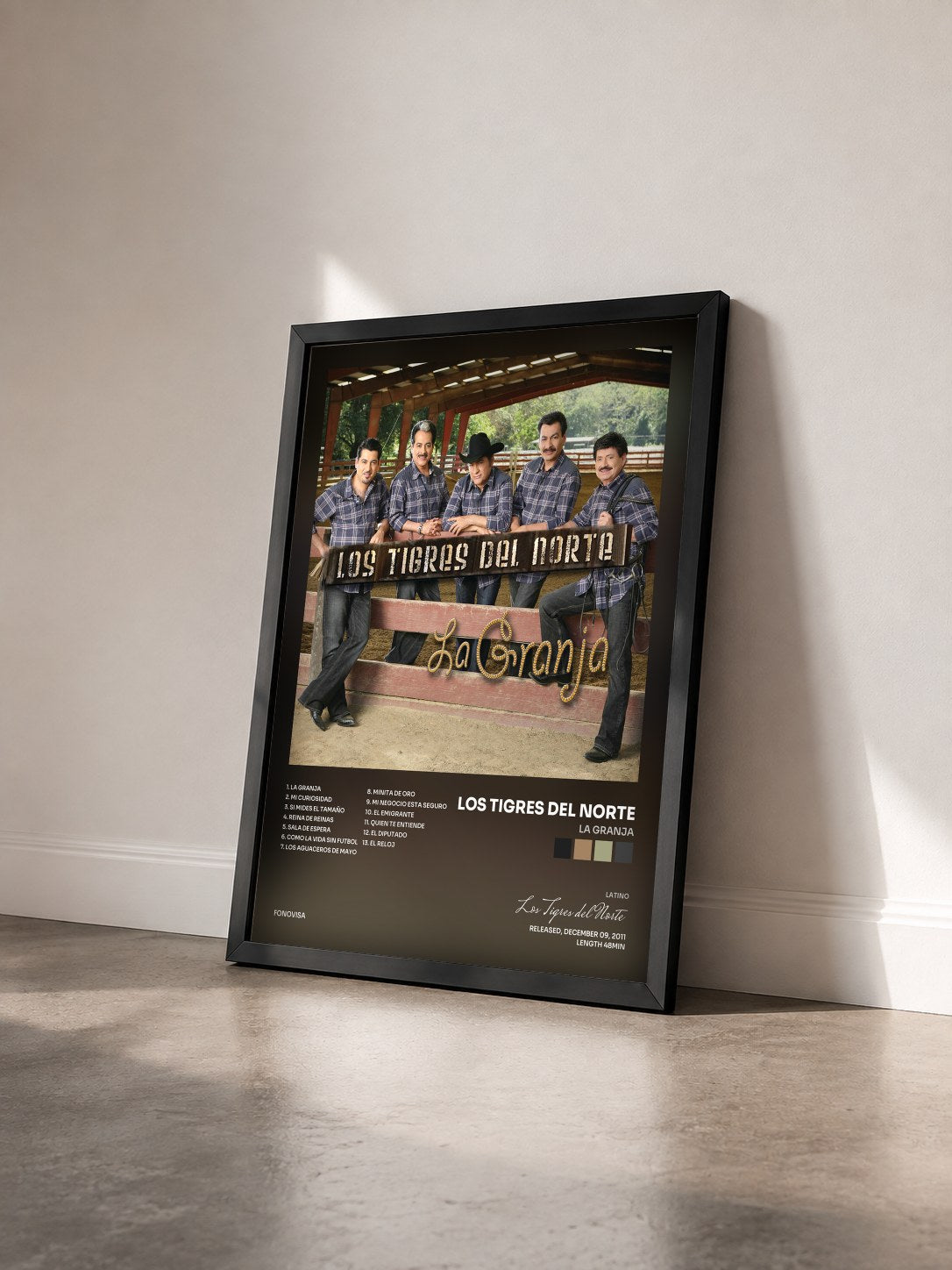 #noir Tableau de l'album La Granja de Los Tigres del Norte vu de trois quarts, cadre noir