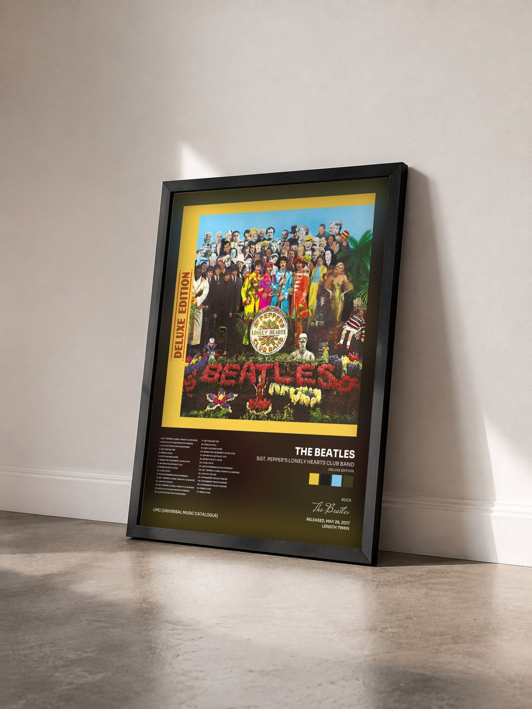 #noir Sgt. Pepper's Lonely Hearts Club Band (Deluxe Edition) by The Beatles as a framed art print seen at an angle, black frame