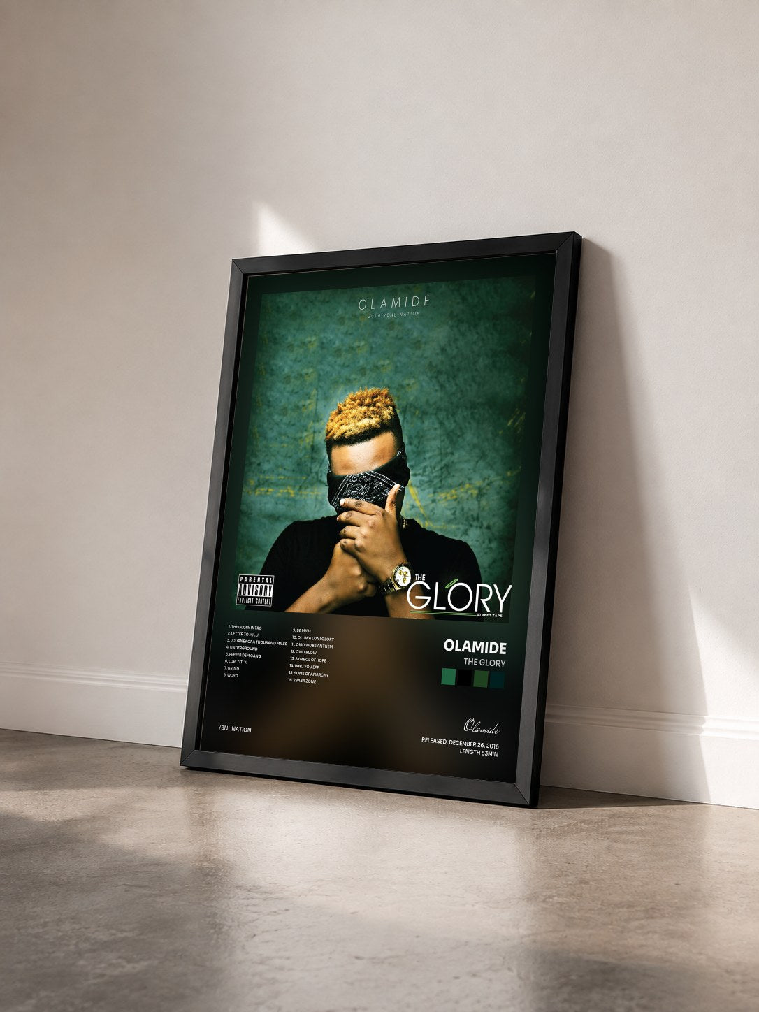 #noir Tableau de l'album The Glory de Olamide vu de trois quarts, cadre noir