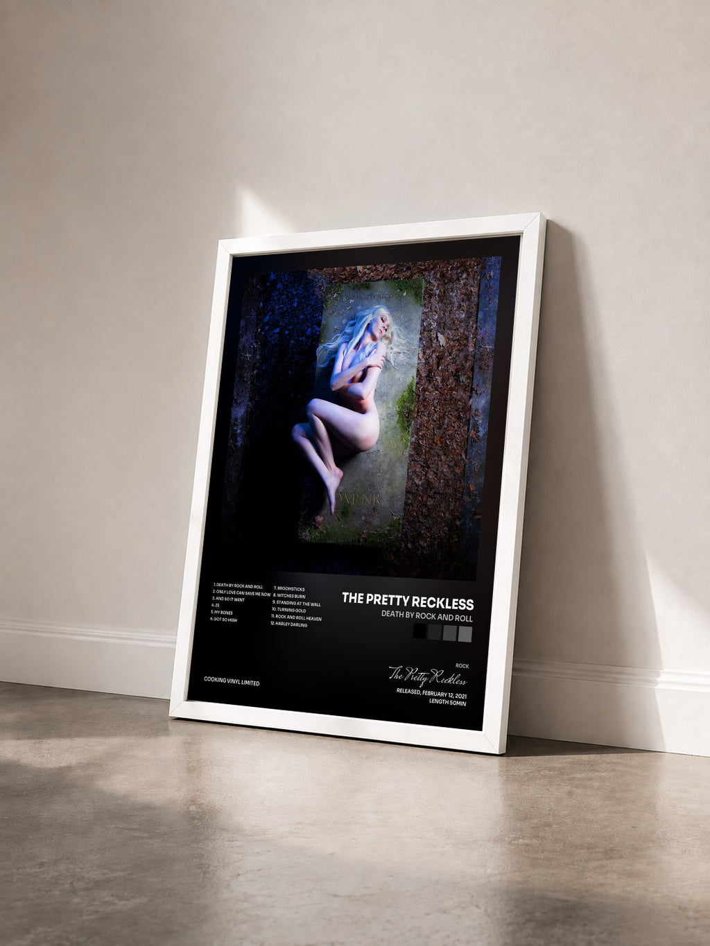 #blanc Death by Rock and Roll by The Pretty Reckless as a framed art print seen at an angle, white frame