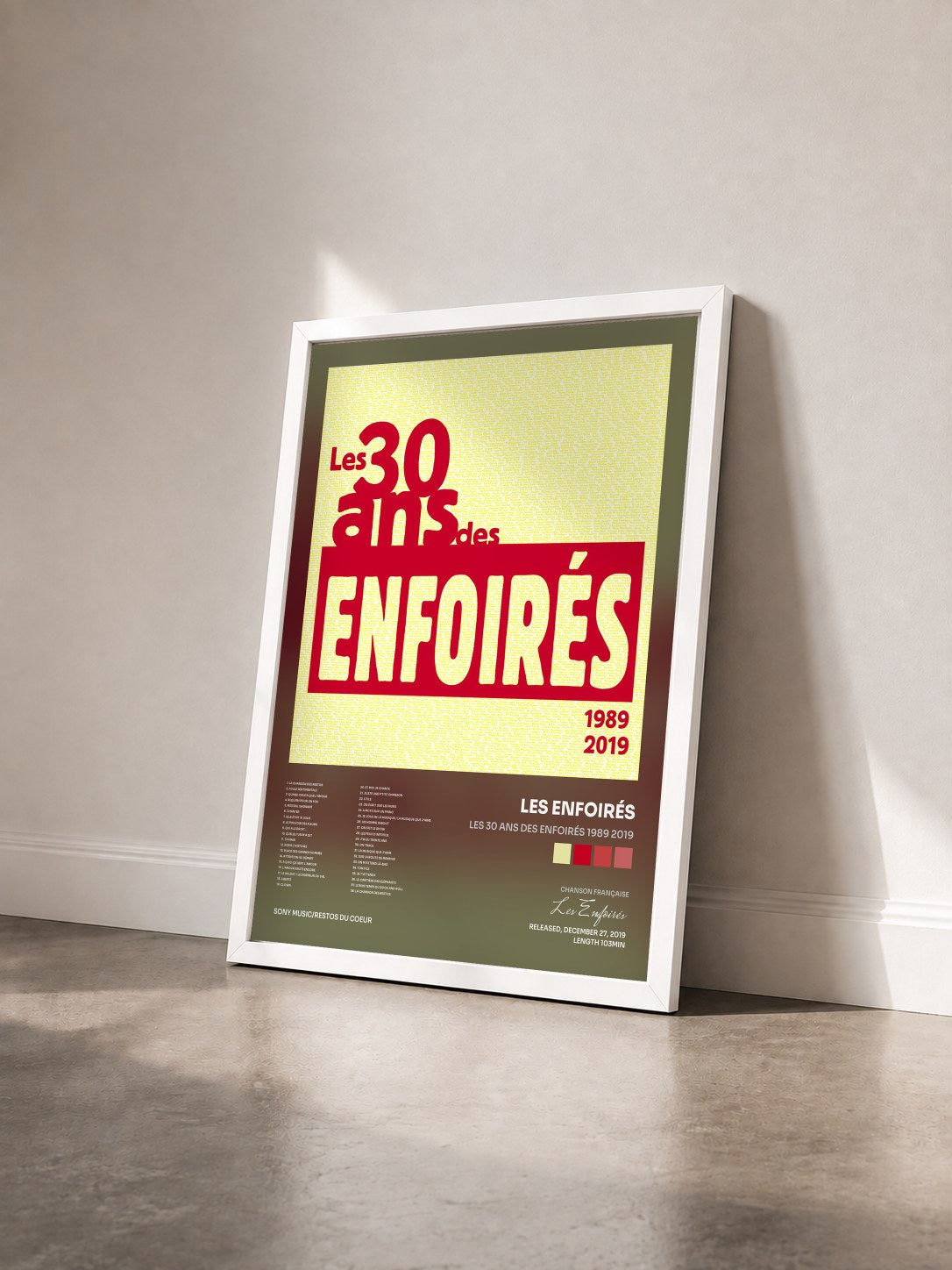 #blanc Tableau de l'album Les 30 ans des Enfoirés 1989 2019 de Les Enfoirés vu de trois quarts, cadre blanc