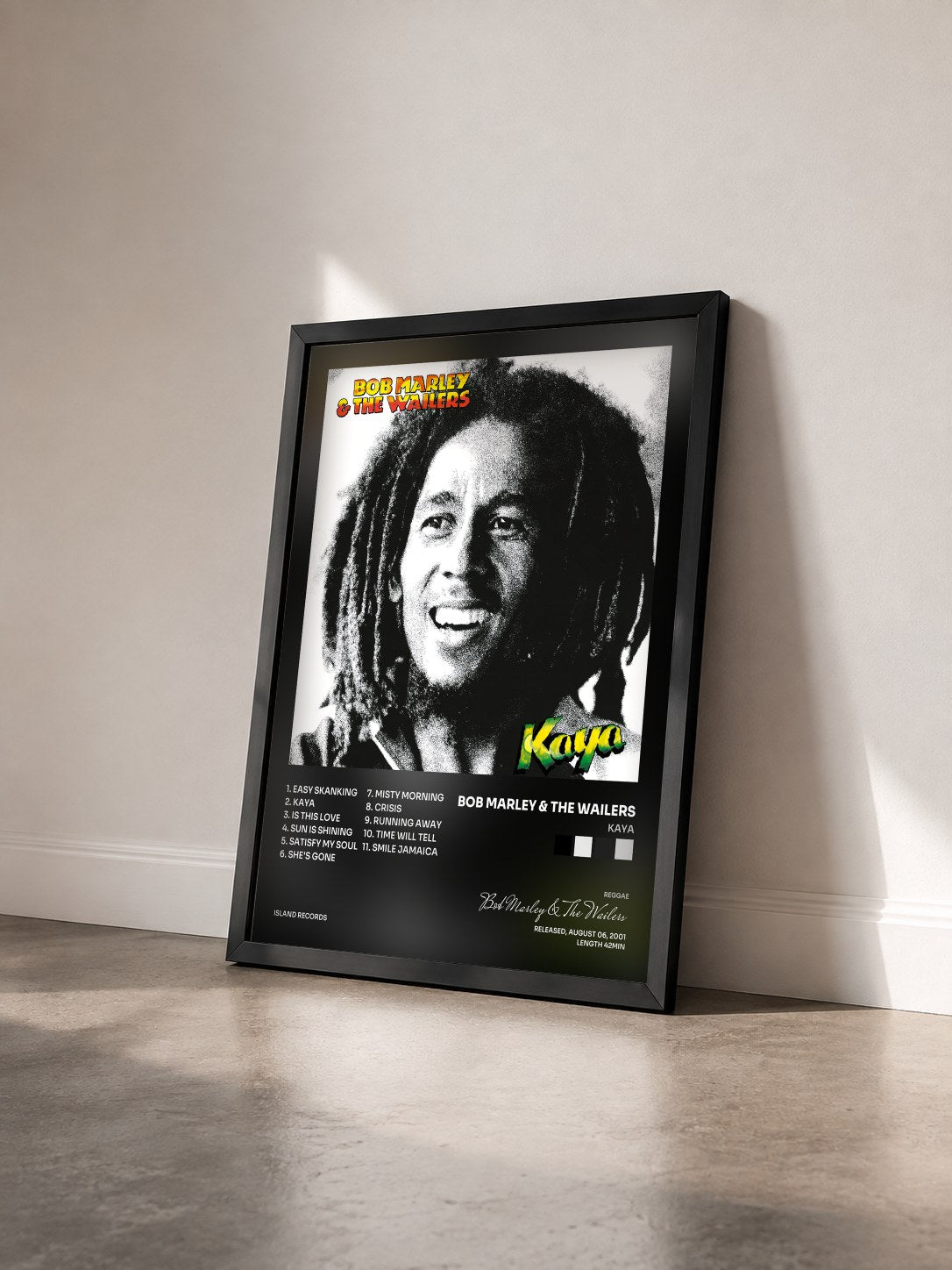 #noir Kaya by Bob Marley & The Wailers as a framed art print seen at an angle, black frame