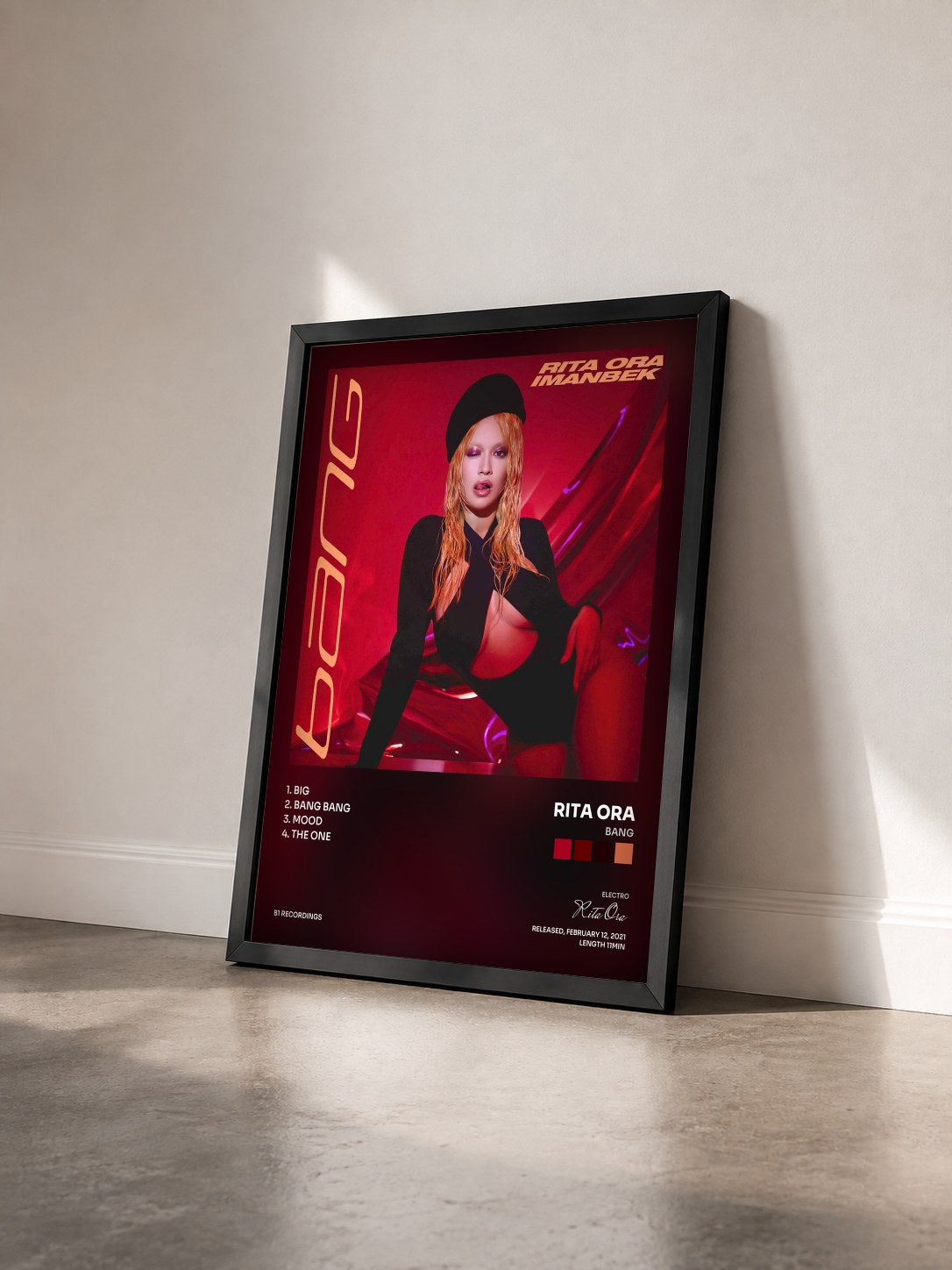 #noir Bang by Rita Ora as a framed art print seen at an angle, black frame
