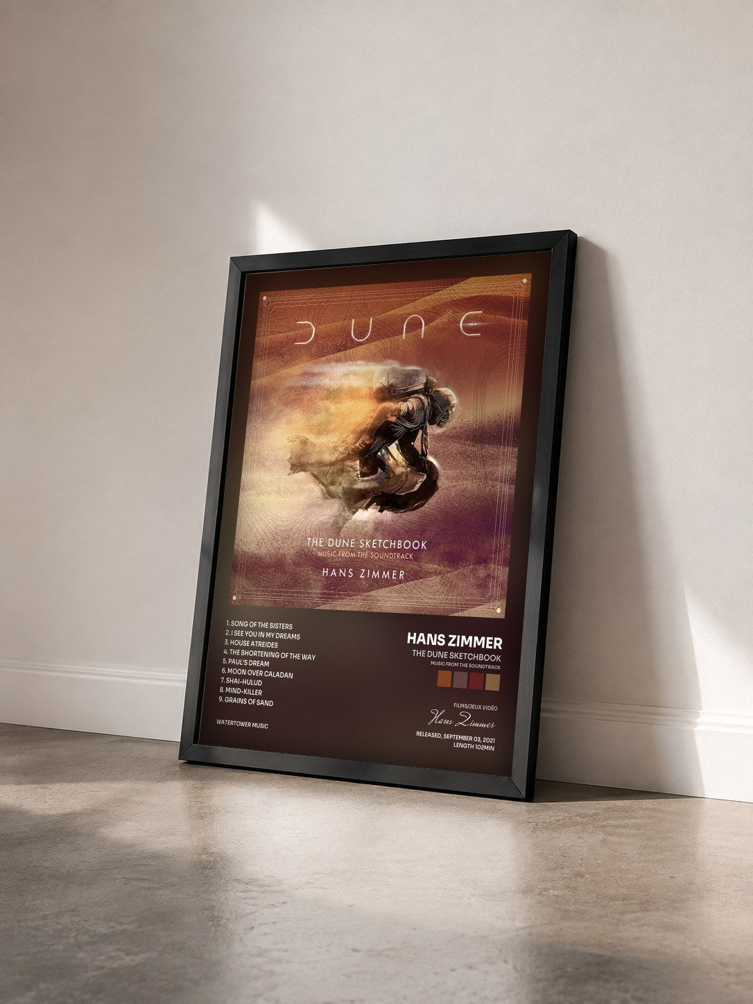 #noir Tableau de l'album The Dune Sketchbook (Music from the Soundtrack) de Hans Zimmer vu de trois quarts, cadre noir