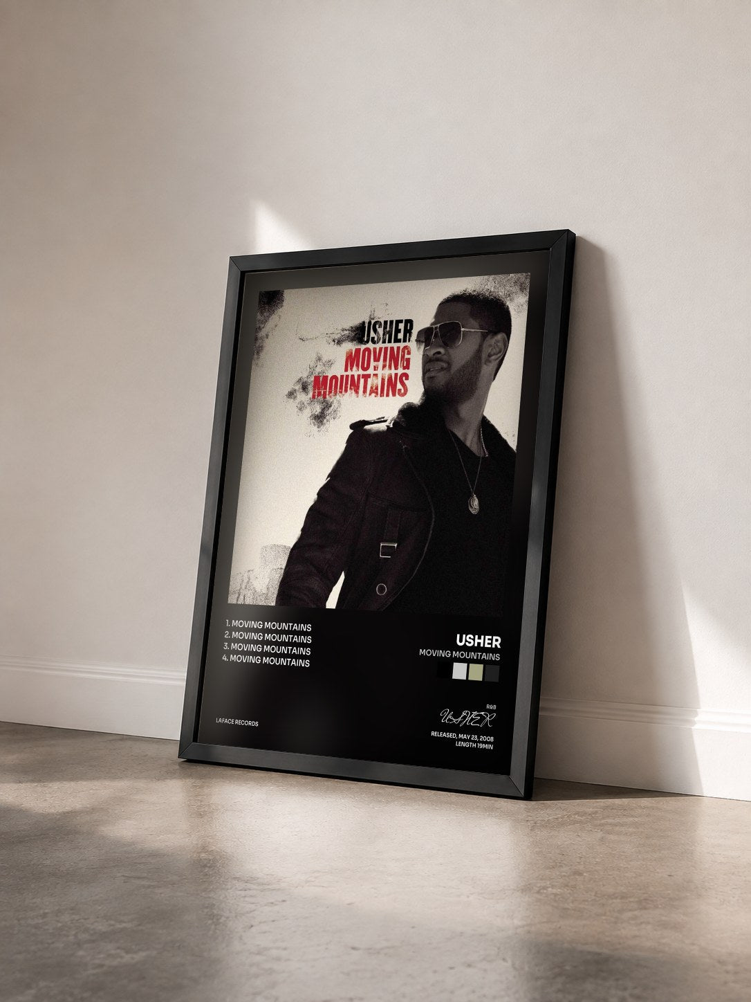 #noir Tableau de l'album Moving Mountains de USHER vu de trois quarts, cadre noir